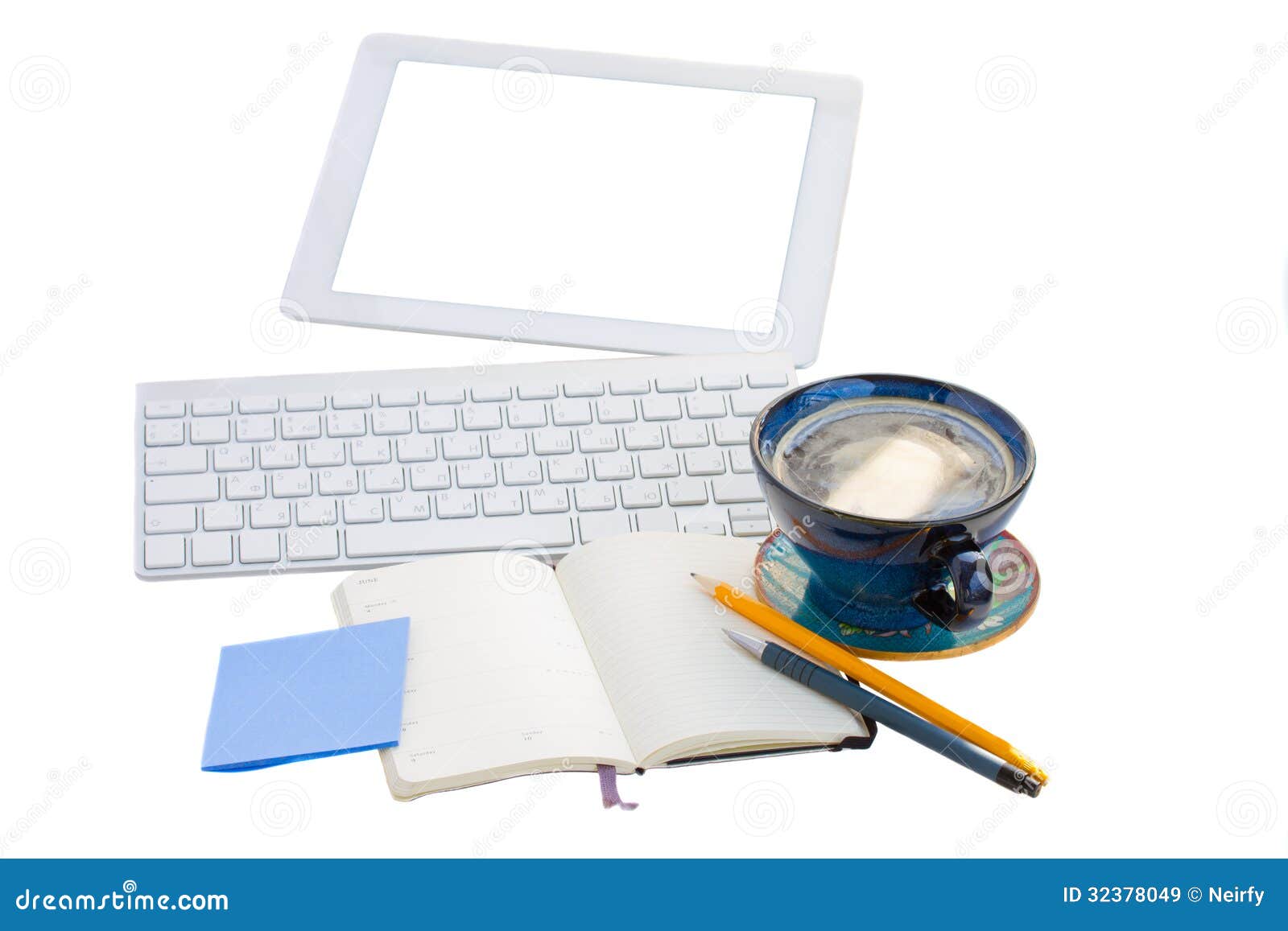 open notebook with key board and tablet