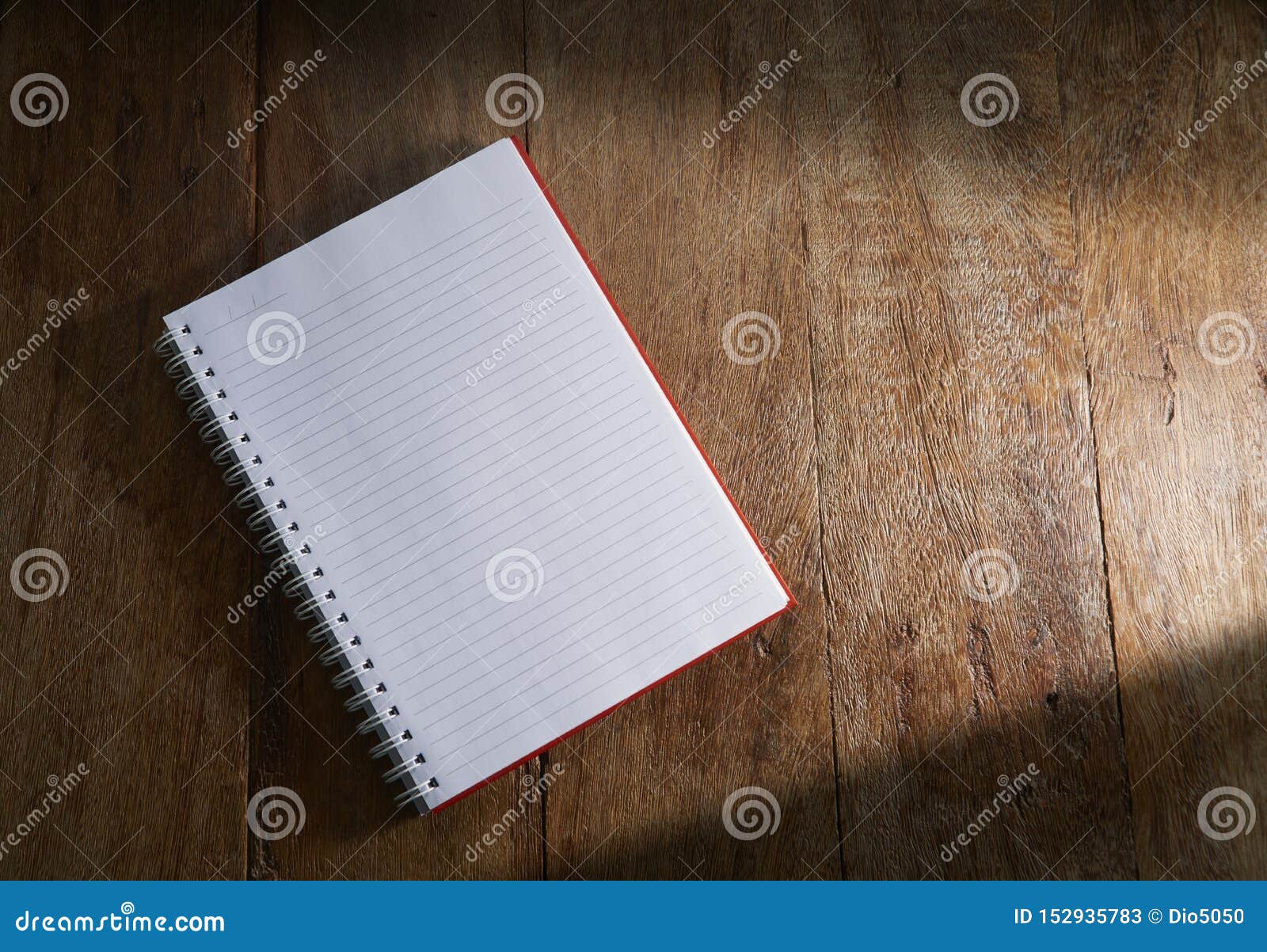 open notebook on wooden background.