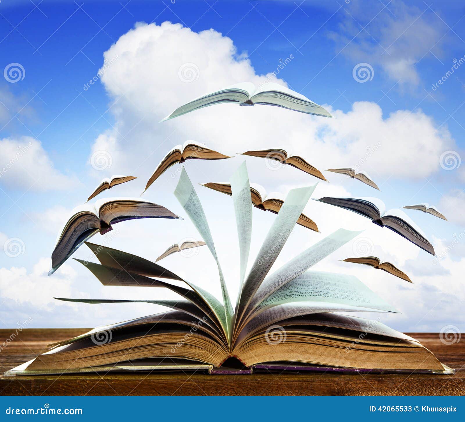 Open Old Book Page On Wood Table With Flying Book Page