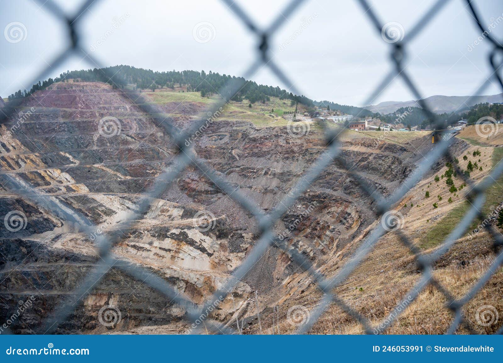 Open Pit Mine in Background with a Blurred Chain Link Fence in the  Foreground. Stock Image - Image of gypsum, industry: 246053991