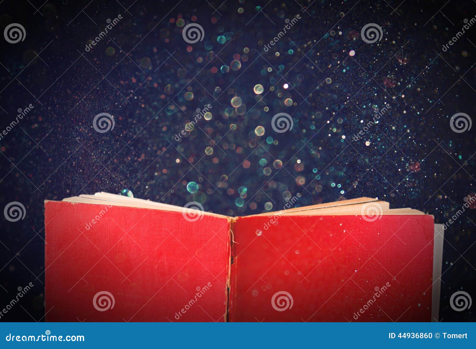 Open Red Book and Glowing Glittering Lights. Stock Photo Image of