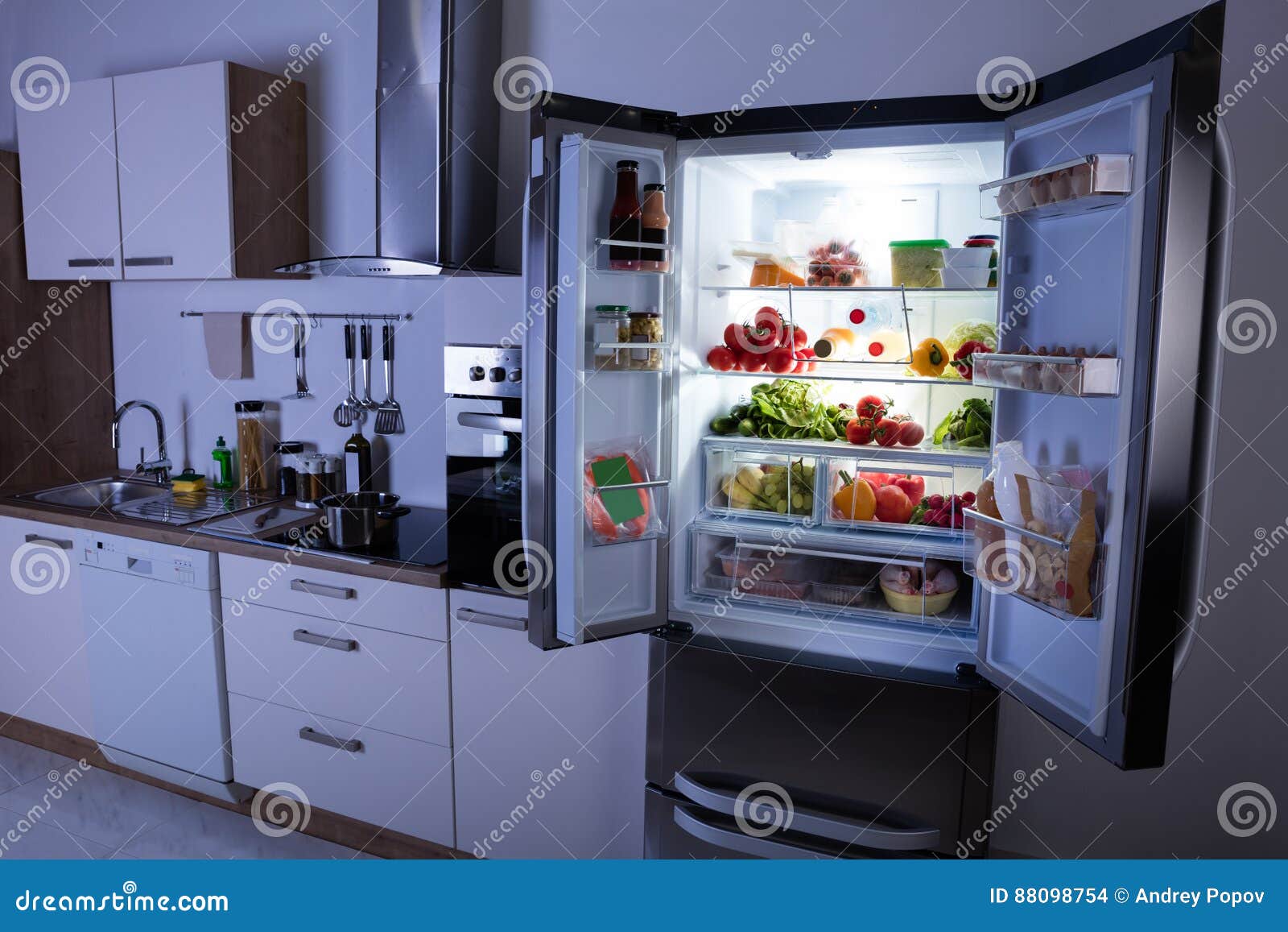 open refrigerator in modern kitchen