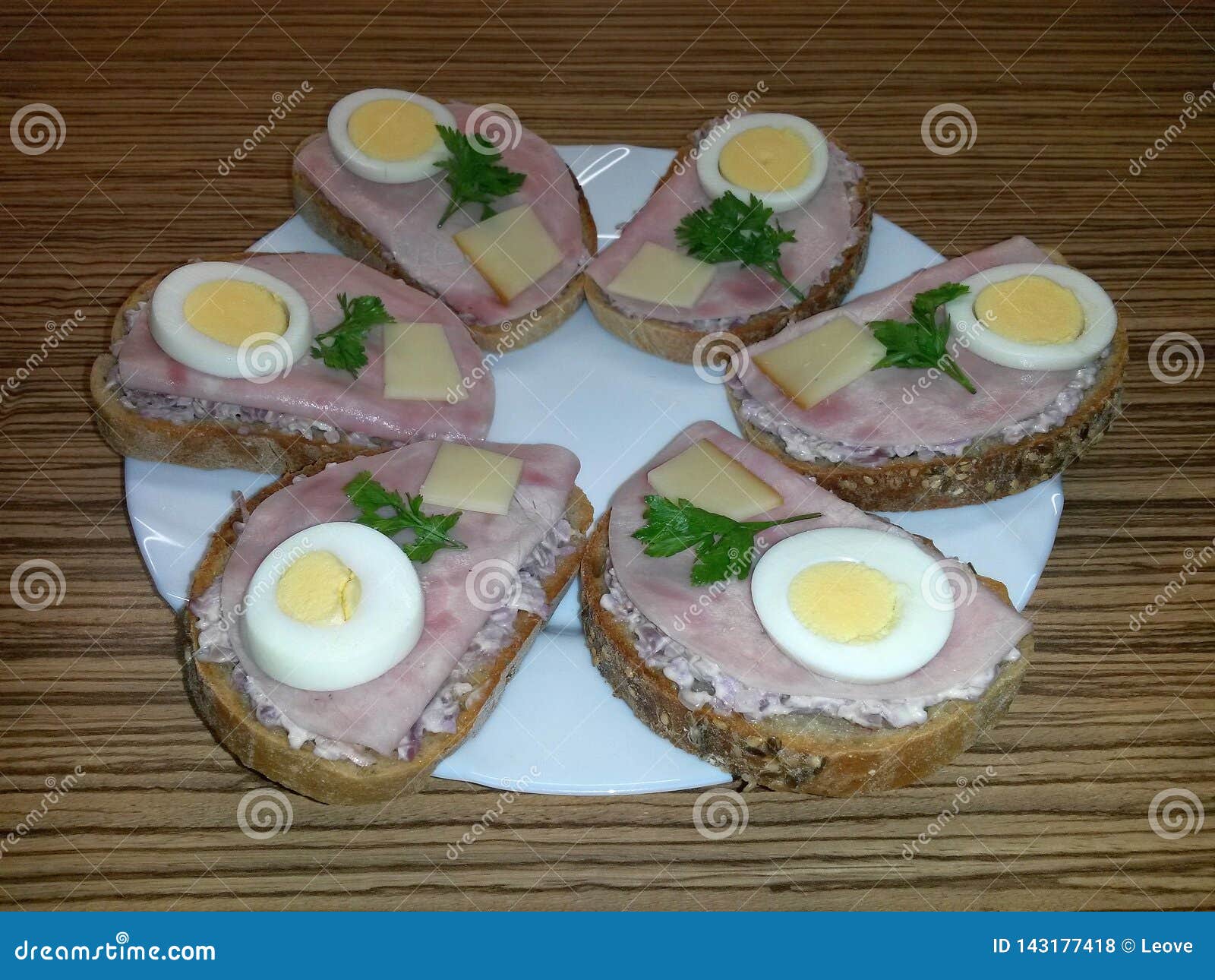 Open Sandwiches on Plate with Salad, Ham, Egg, Cheese, Parsley Stock