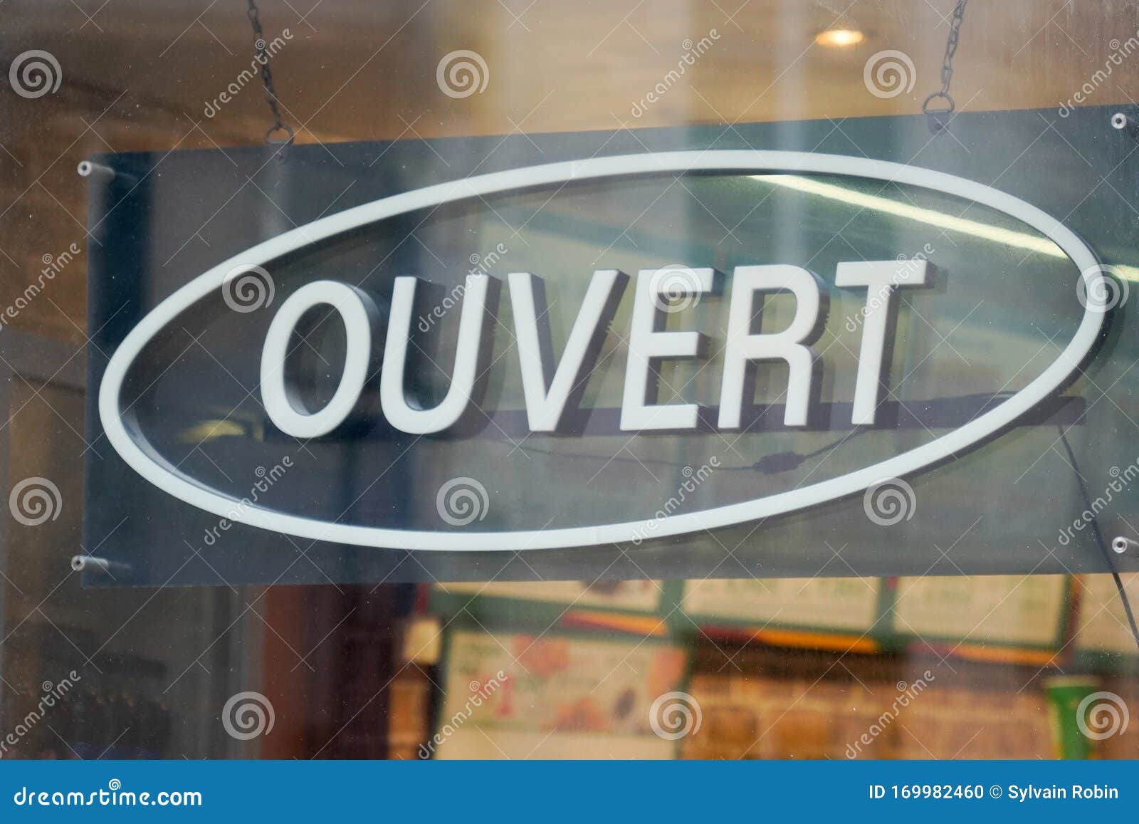 Sign at the entrance of a restaurant saying in French - Ouvert - meaning in  English - Open Stock Photo - Alamy