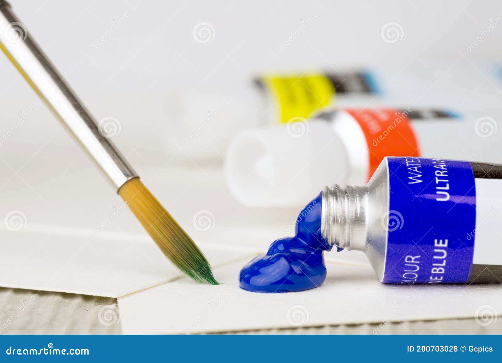 An Open Tube of Blue Watercolor Paint and Paint Brush Stock Photo ...