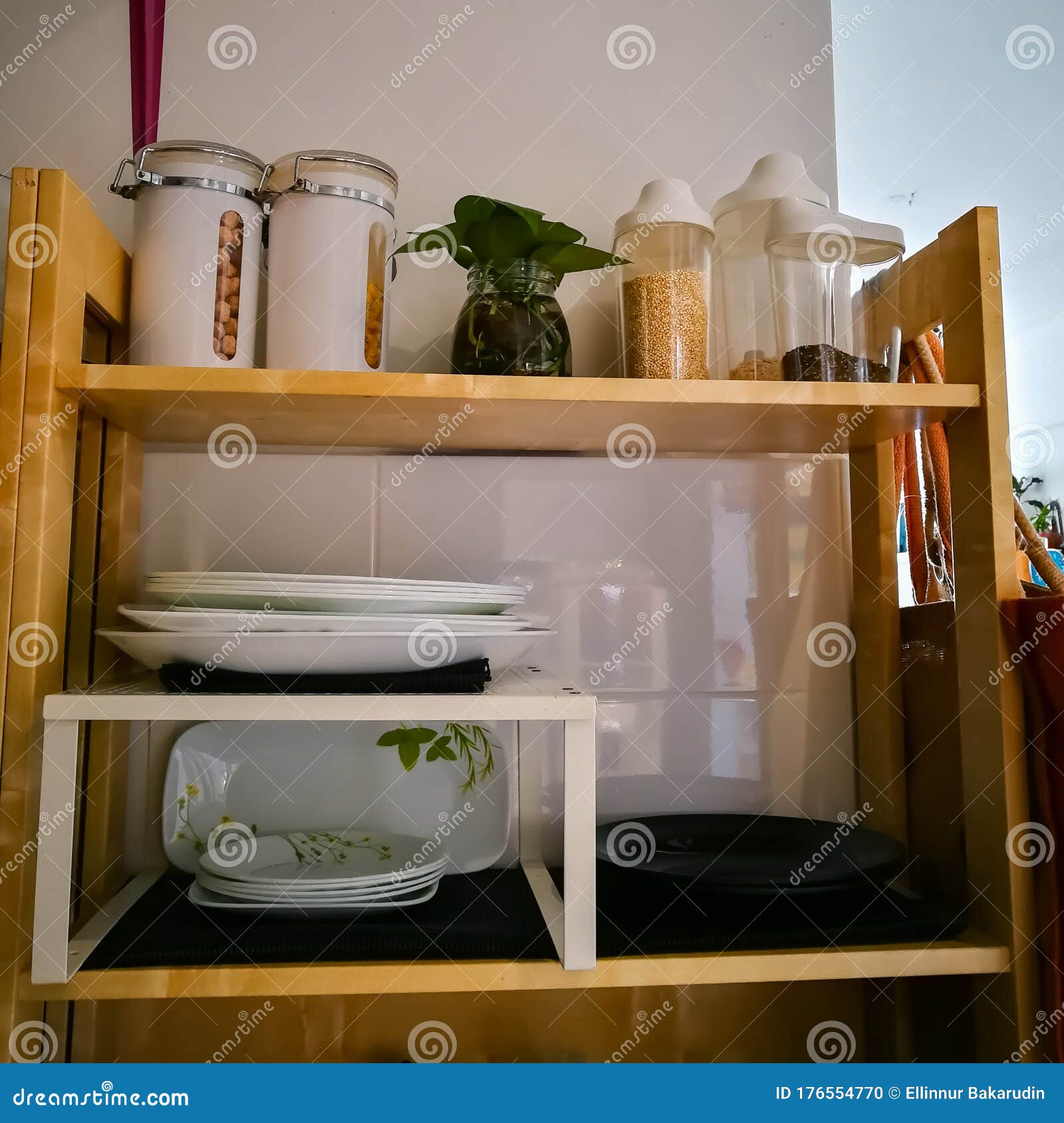 Open Wooden Shelves in the Kitchen, Pantry. View of the Organized
