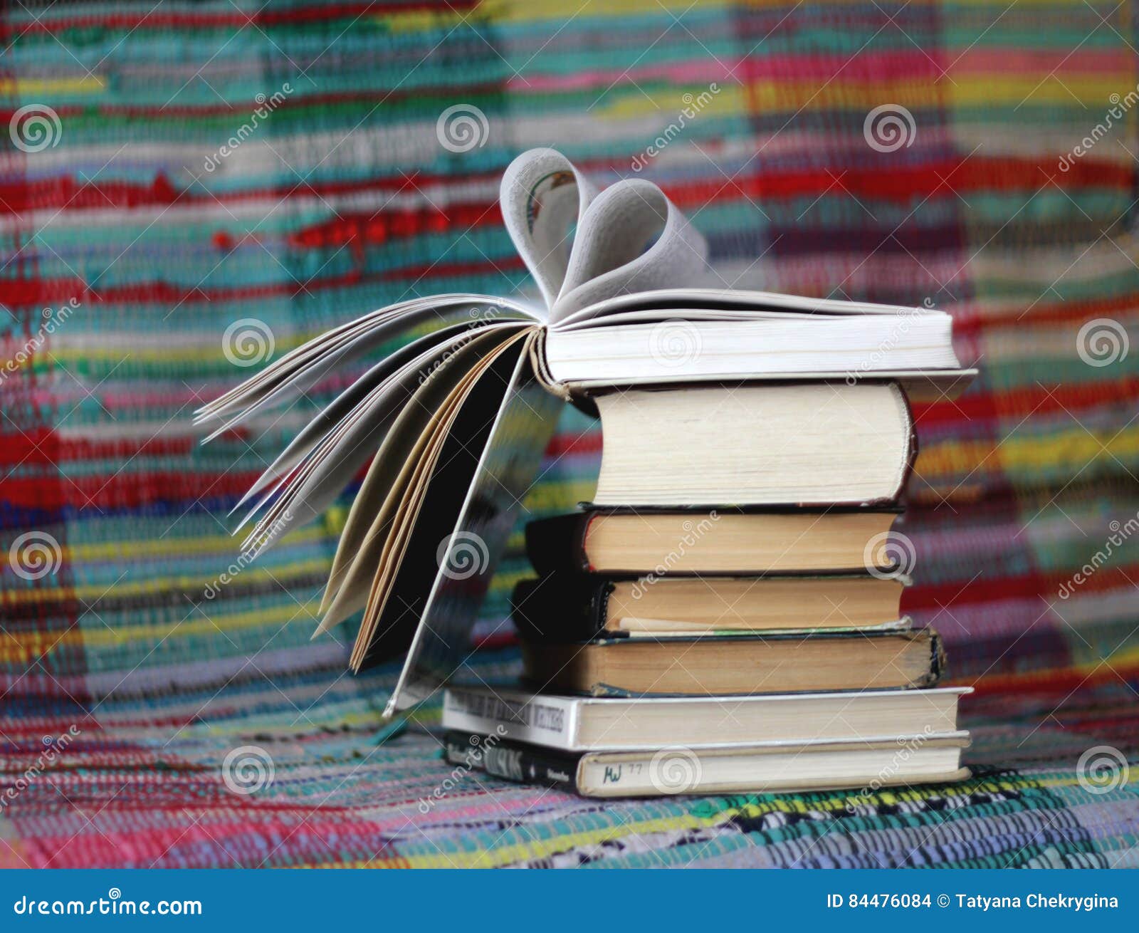 Opened Book With Heart Shaped Pages On Colourful Background Stock