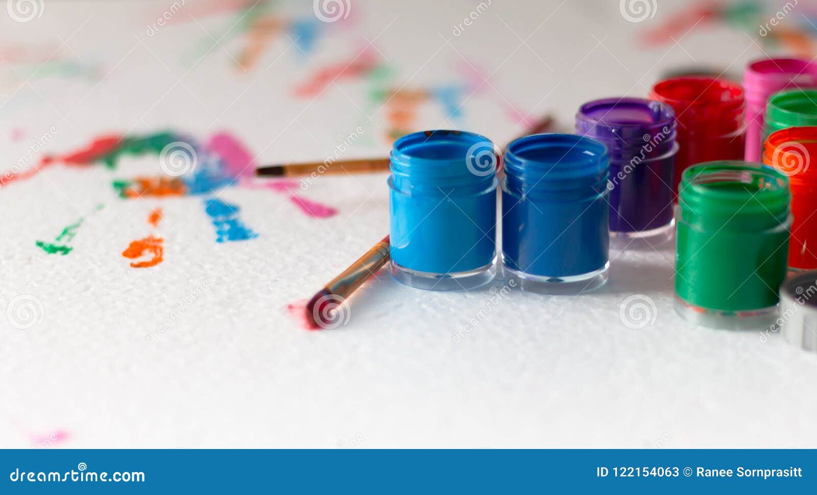 Opened Bottles of Poster Color and Brush on White Background Stock ...