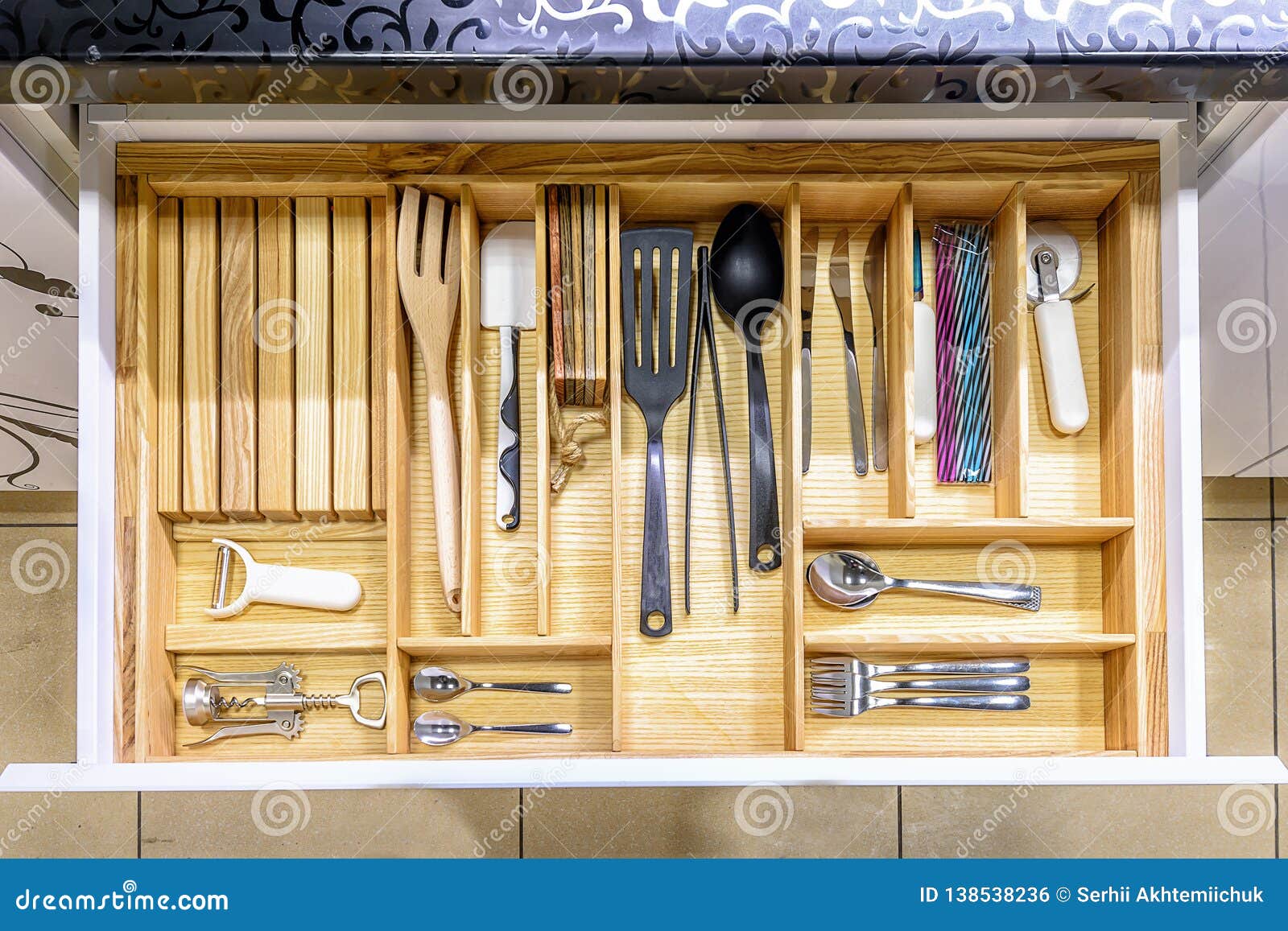 opened kitchen drawer , a smart solution for kitchen storage and organizing