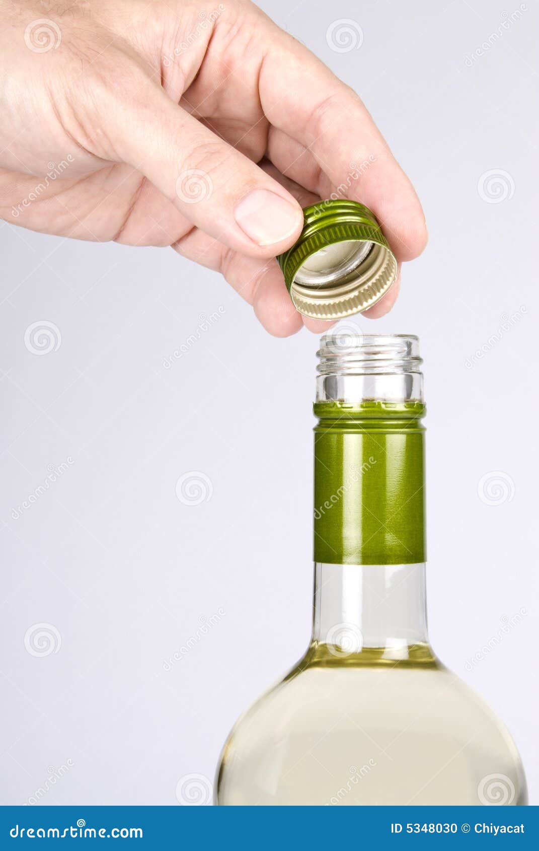 Opening a Screwcap on a Bottle of White Wine Stock Photo Image of