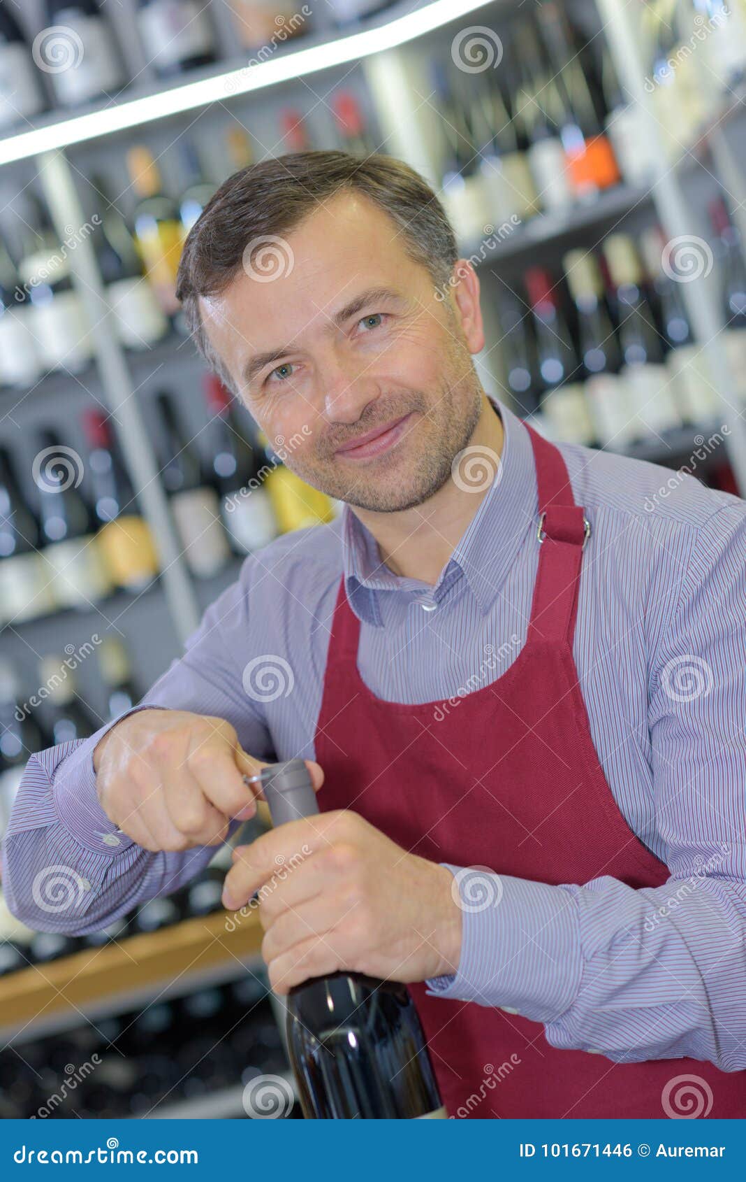 Opening Wine Bottle With Corkscrew In Bar Stock Photo ...