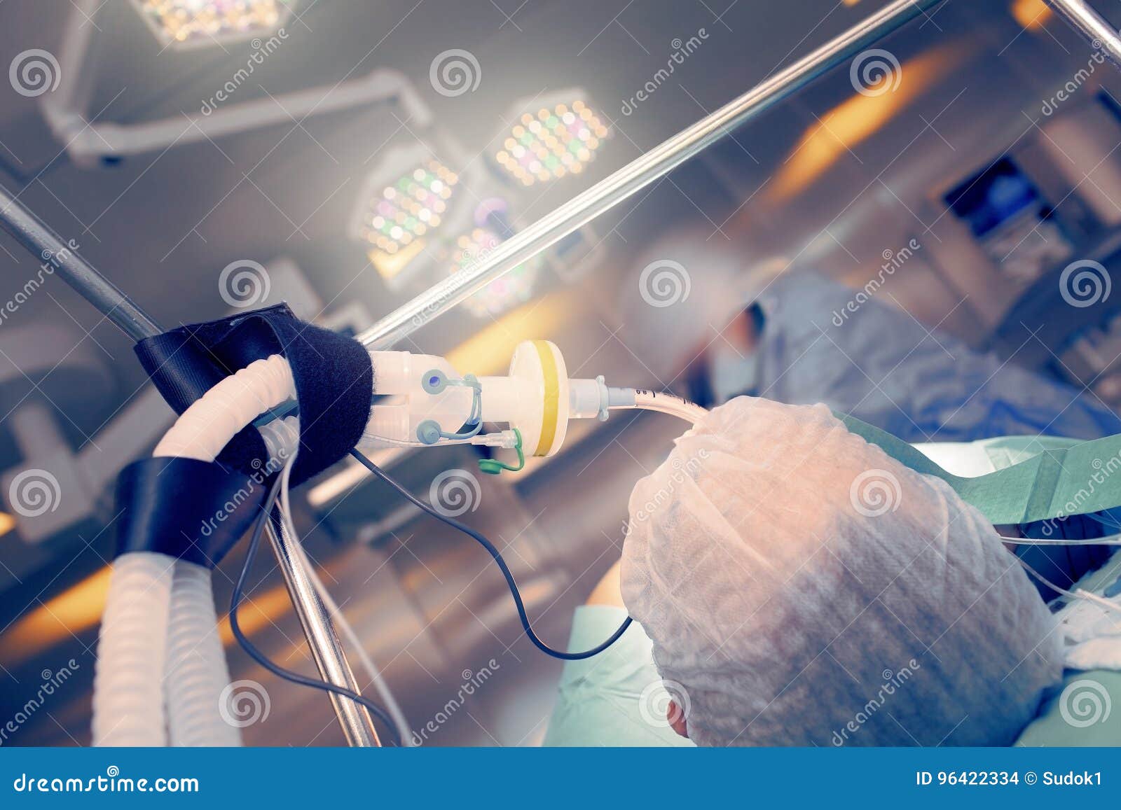 operating room with working staff next to the patient