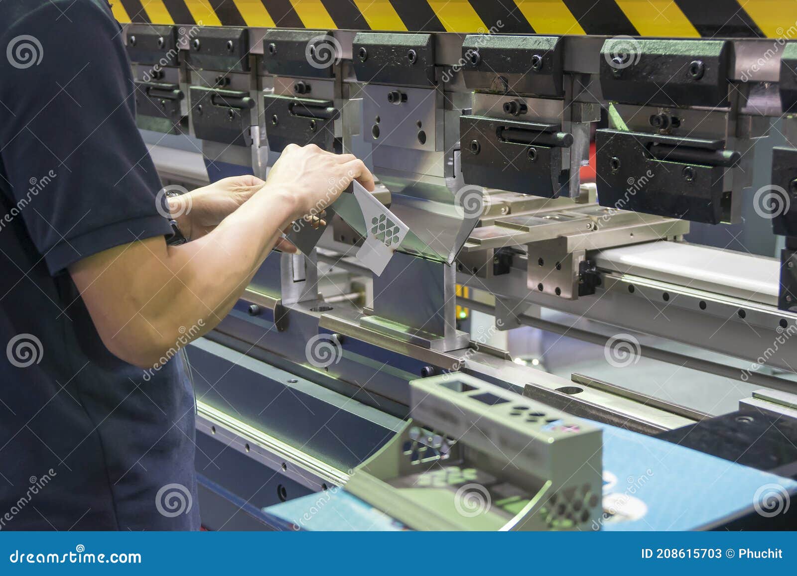 The Operation of Hydraulic Bending Machine with Technician. Stock Image