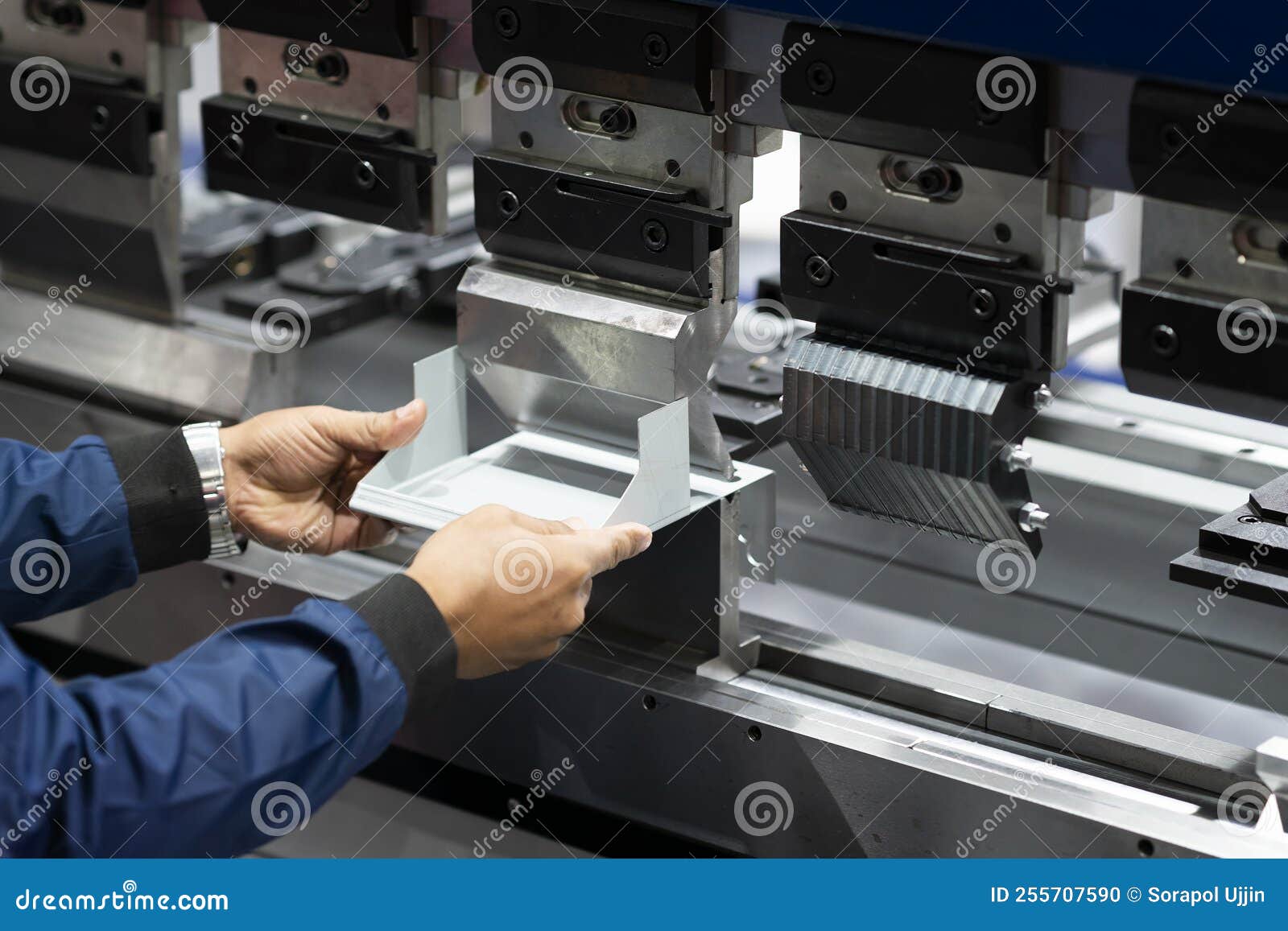 Operator Bending Metal Sheet by Sheet Bending Machine Stock Photo