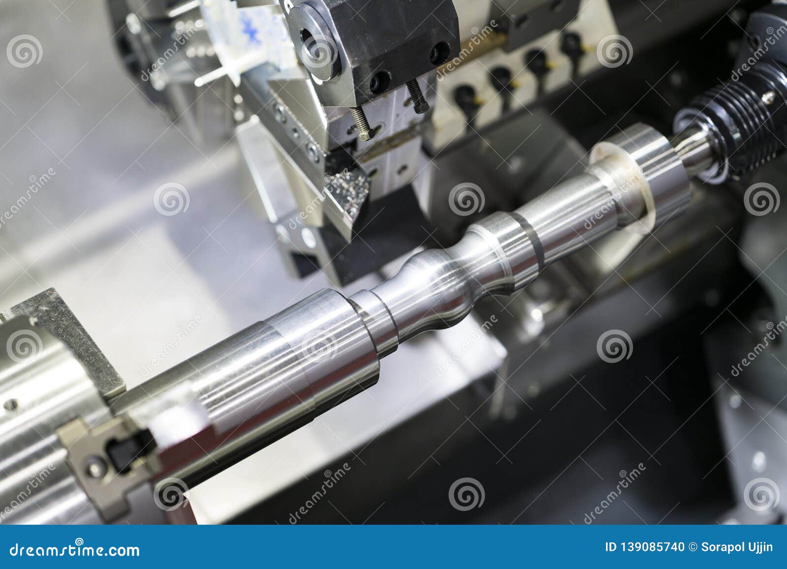 Operator Machining Automotive Part by Cnc Turning Machine Stock Photo