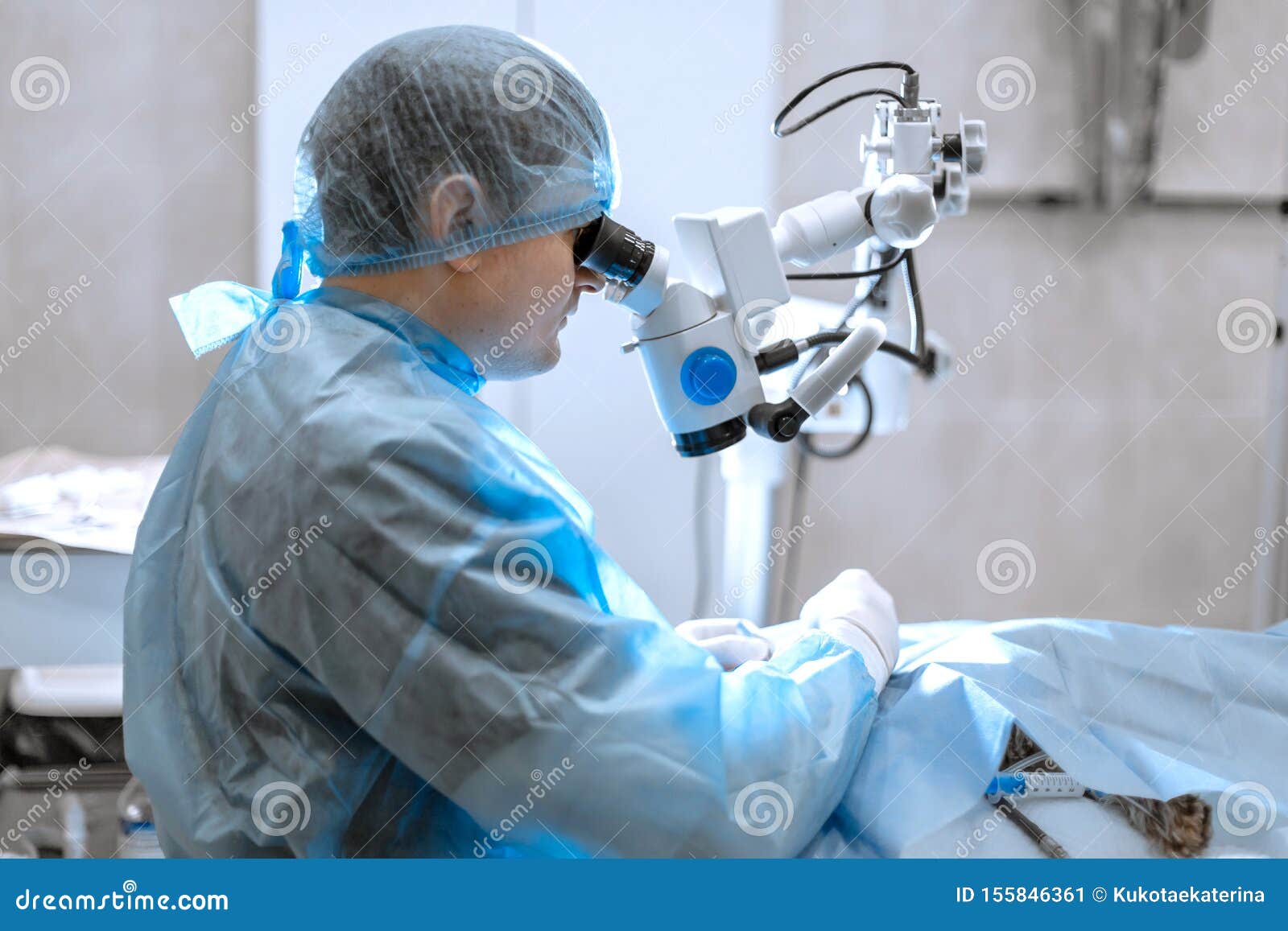 Ophthalmologist Surgeon Looking through Surgical Microscope Doing
