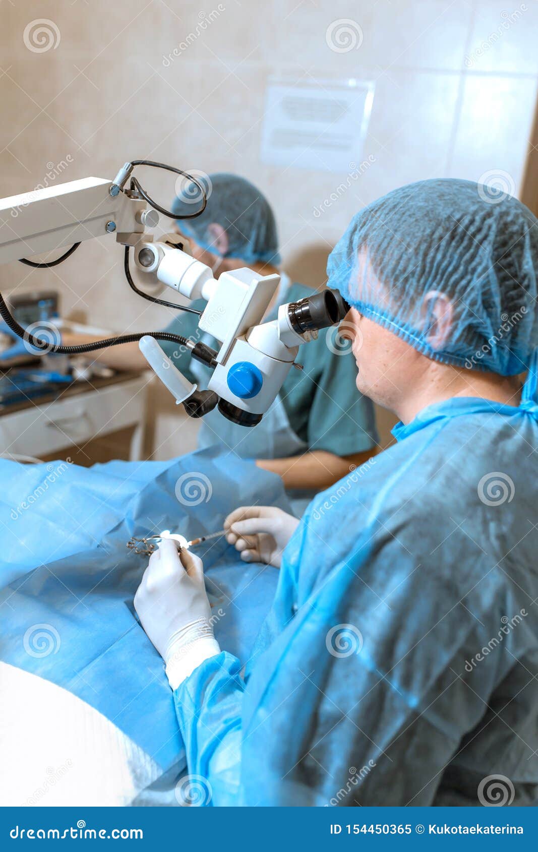Ophthalmologist Surgeon Looking through Surgical Microscope Doing