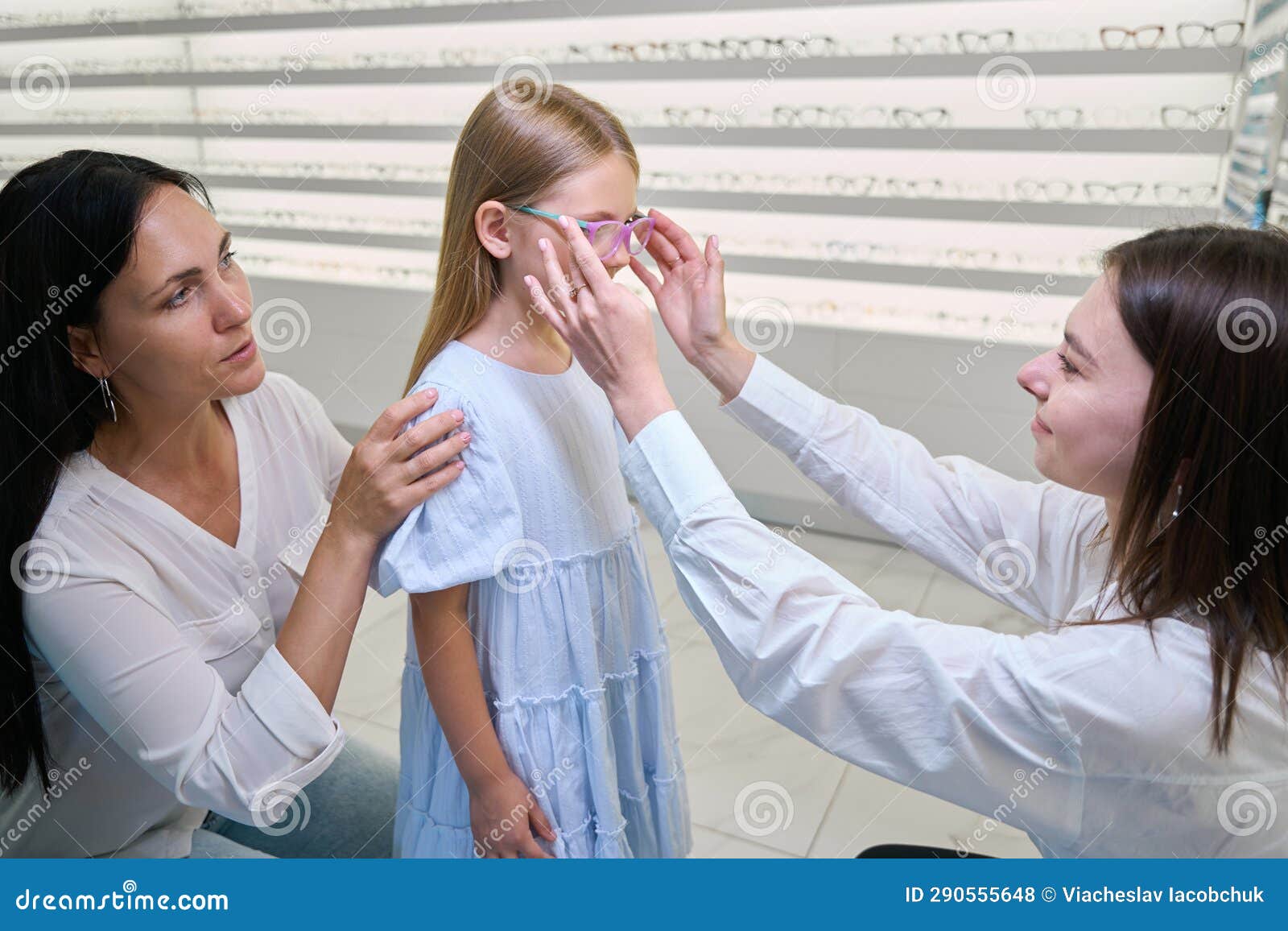 Optical Store Consultant Assisting Child in Selecting New Eyeglasses