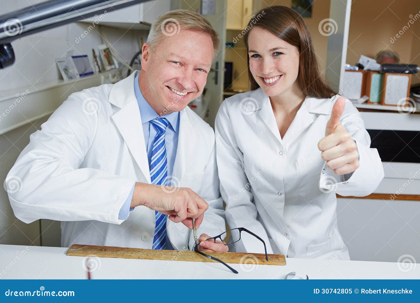 Optician Apprentice Holding Thumbs Stock Image Image of repair