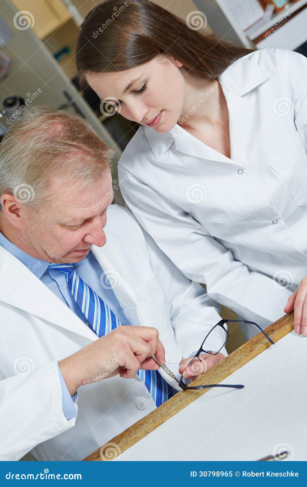 Optician Fixing Glasses in Stock Image Image of help, frame