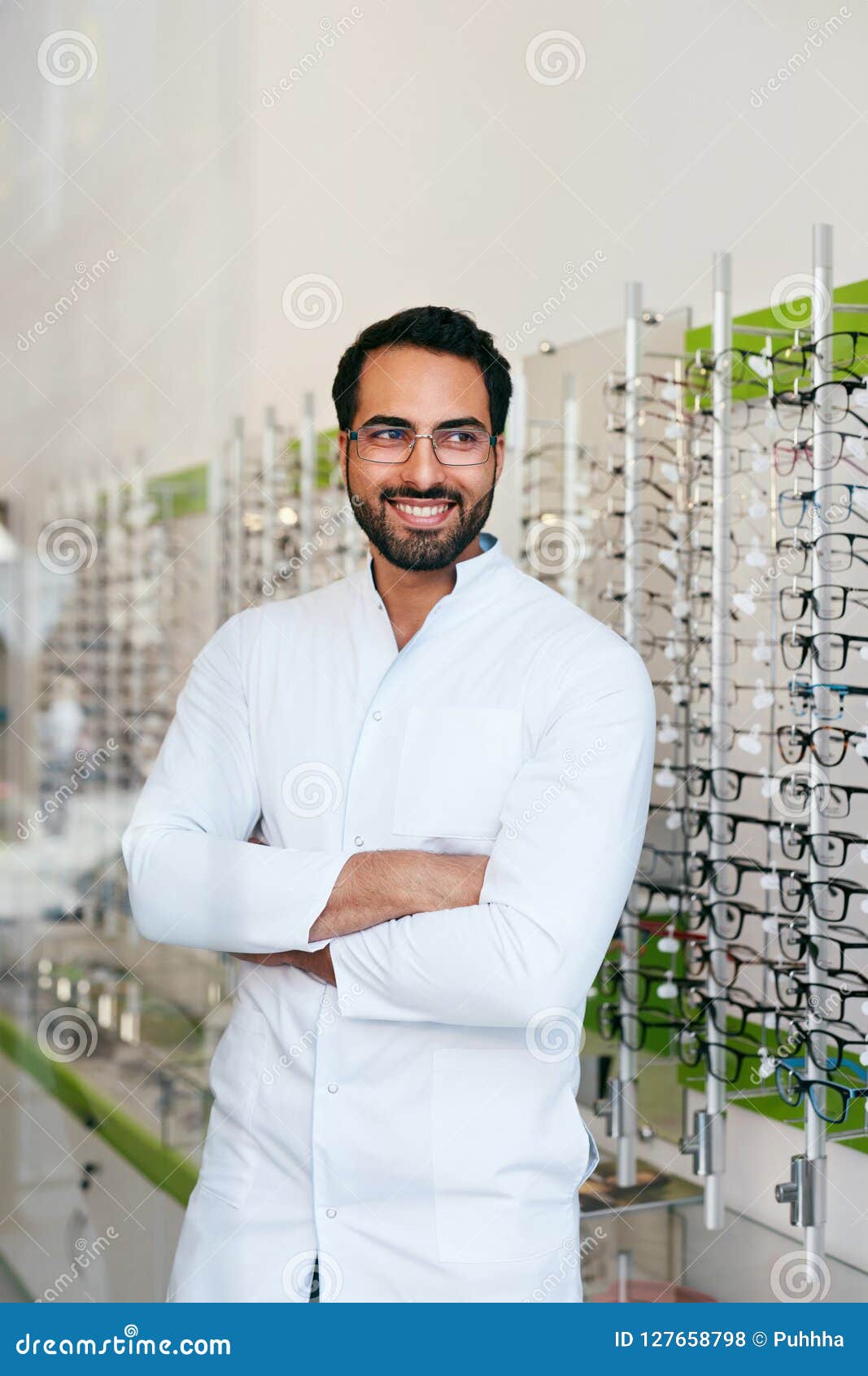 Optician Man Near Showcase With Eyeglasses At Glasses Shop ...