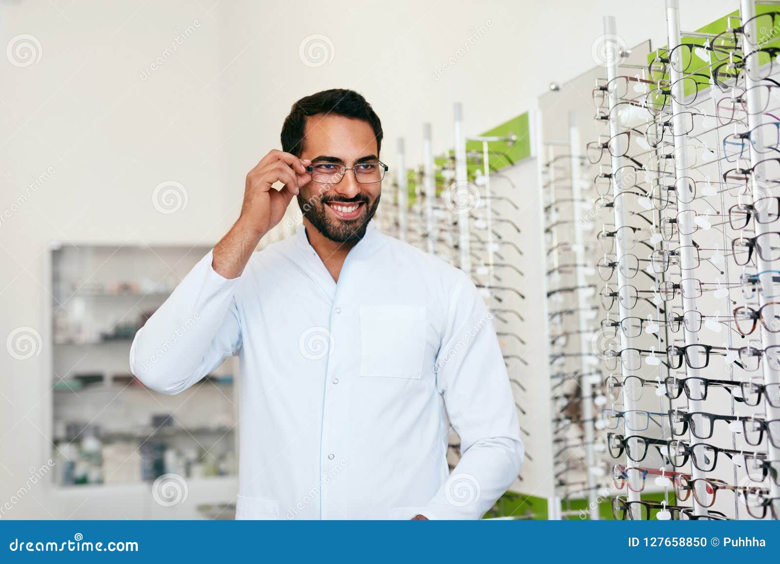 Optician Man Near Showcase with Eyeglasses at Glasses Shop Stock Photo ...