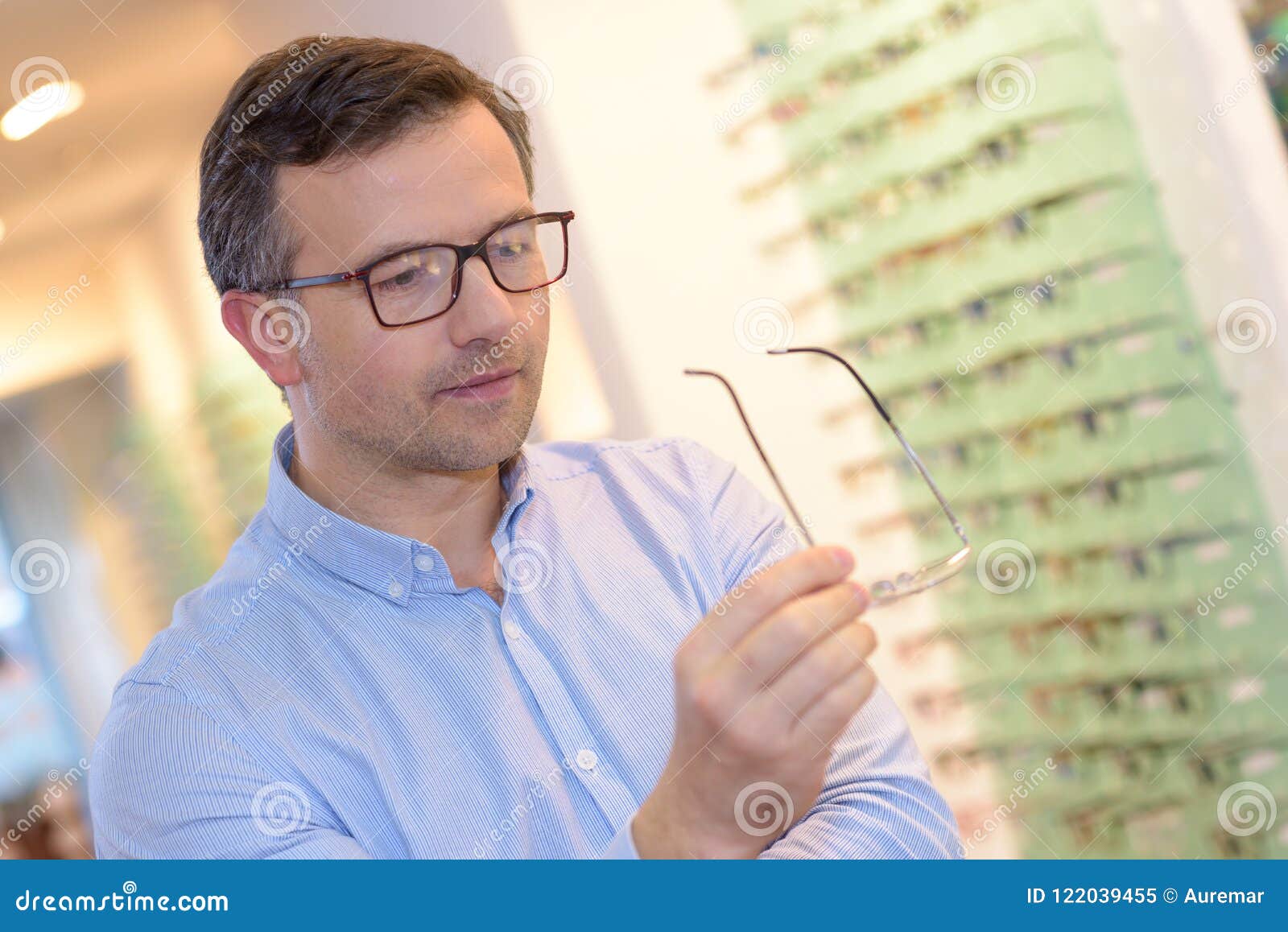 Optician Showing Glasses To Man at Optics Store Stock Image - Image of ...