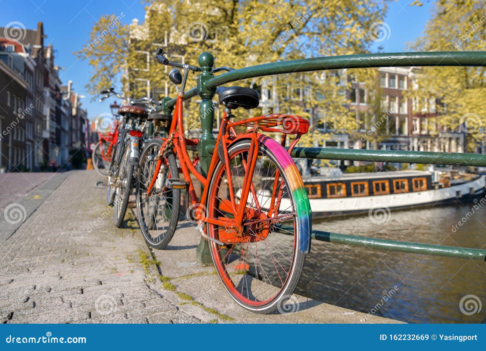 Orange Bike with LGBT Flag Parked on a Bridge in Amsterdam, Netherlands ...