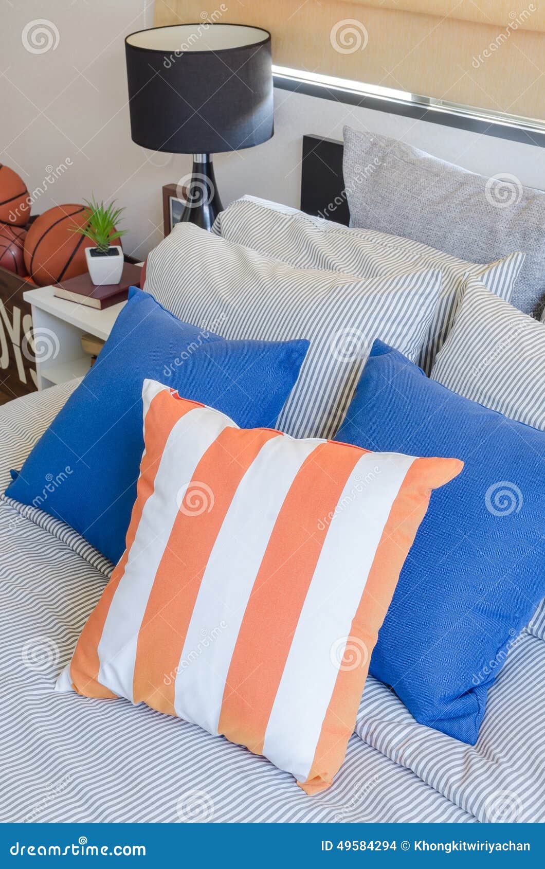 Orange and Blue Pillows on Bed Stock Photo Image of room, fabric