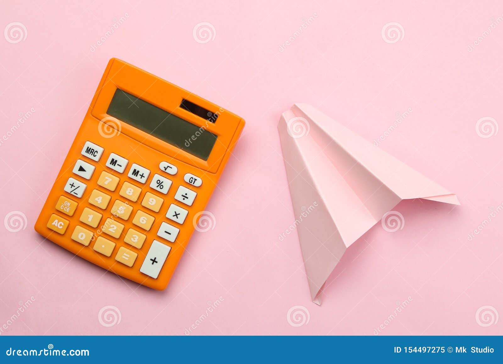 Orange Calculator And Paper Airplane On A Bright Pink Paper Background. Office Supplies