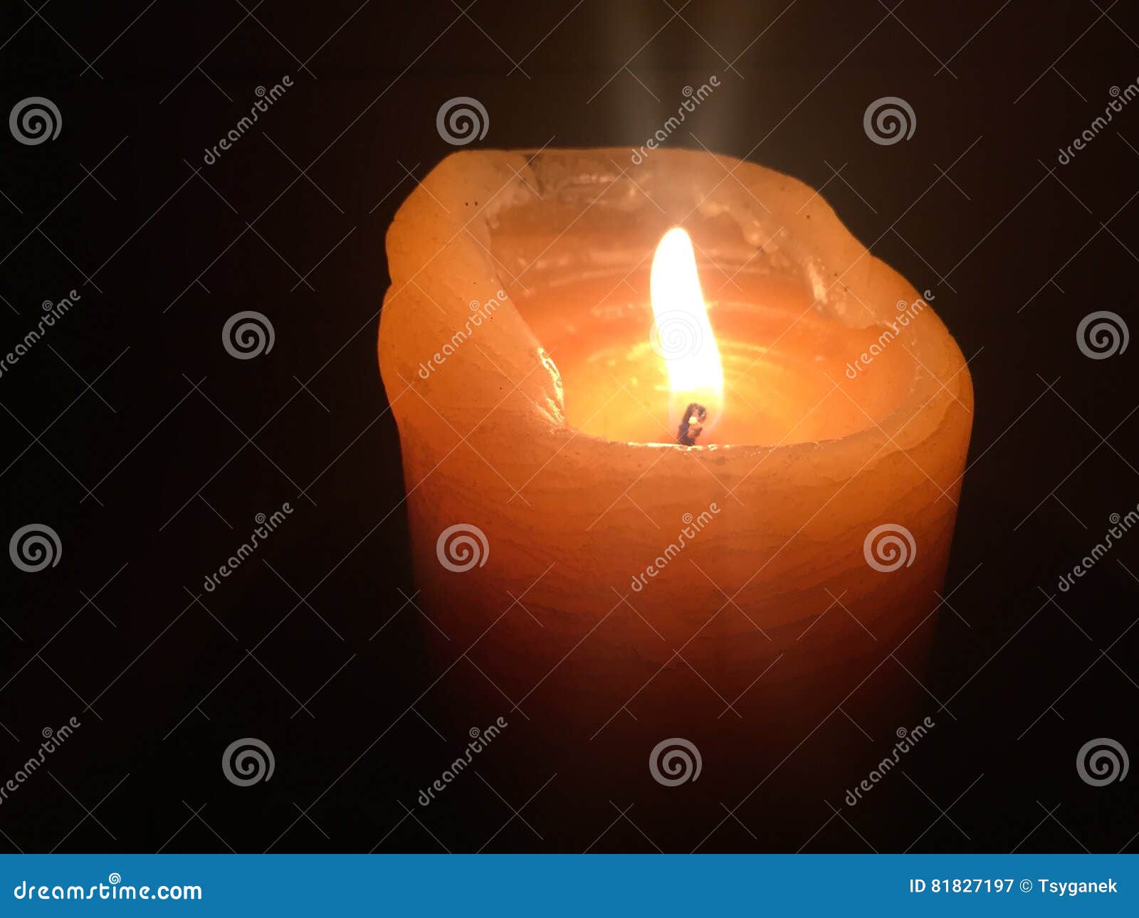 Orange candle in darkness stock image. Image of orange 81827197