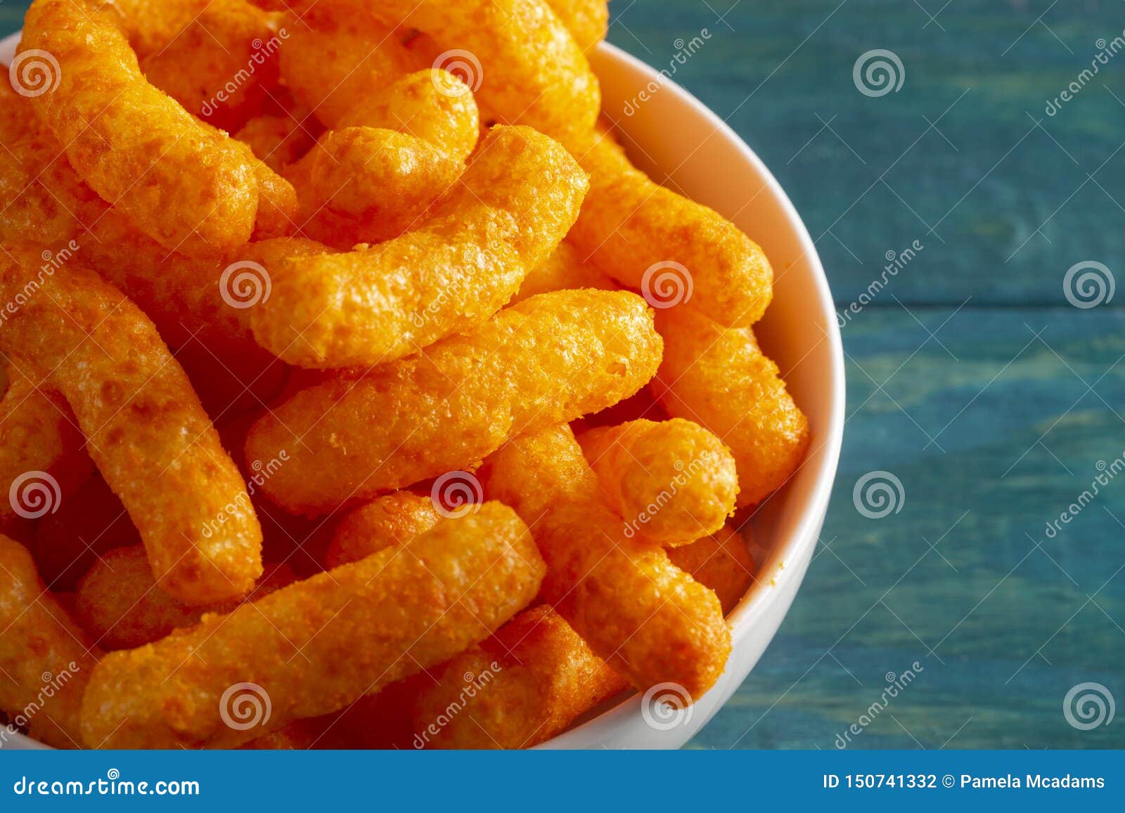 Orange Cheddar Cheese Puffs on a Wood Table Stock Photo Image of