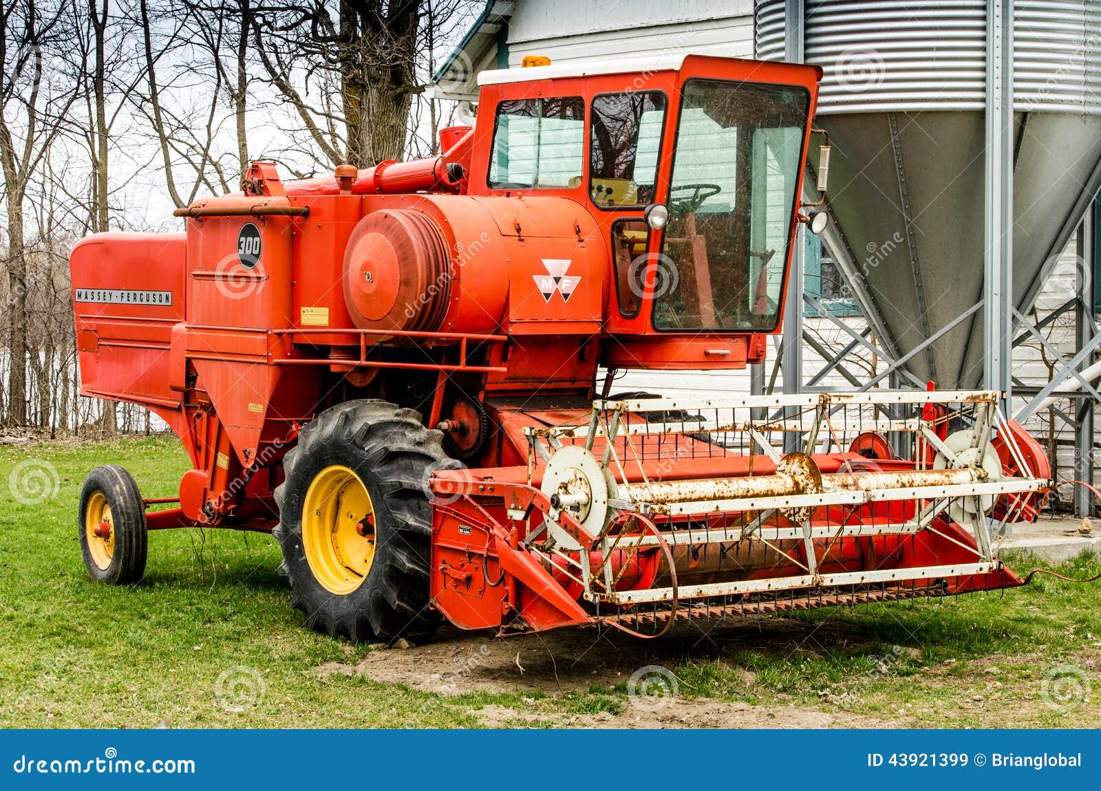 Orange combine harvester editorial stock image. Image of orange 43921399