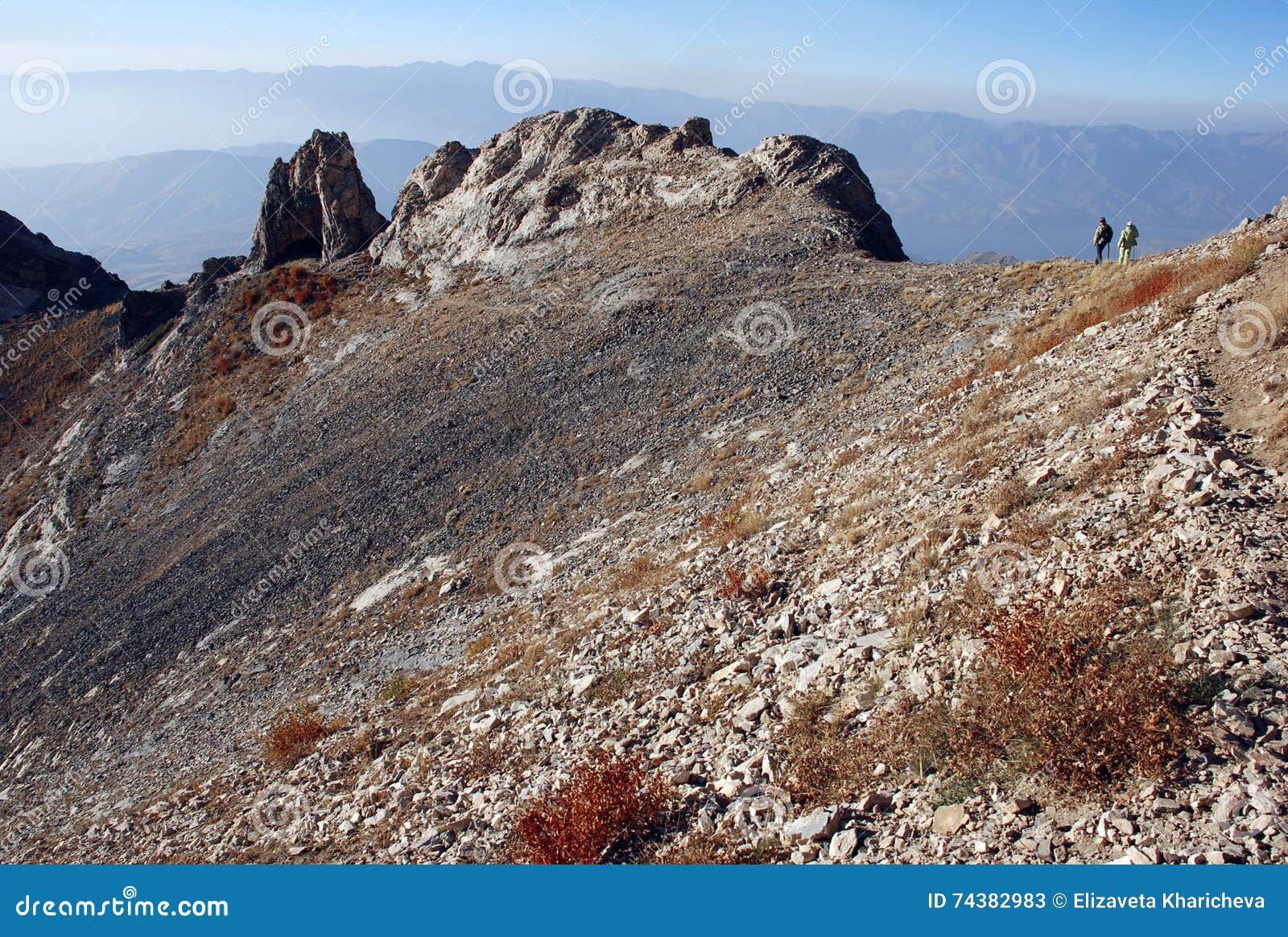 Orange Crest of the Pass in Uzbekistan and Two People Stock Image