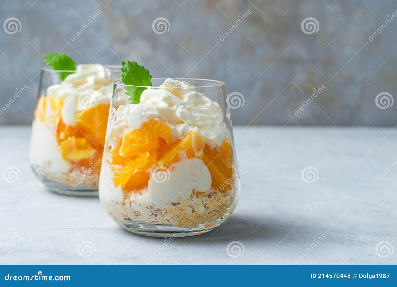 Orange Dessert with Cream and Mint. Two Servings of Fruit Dessert Stock
