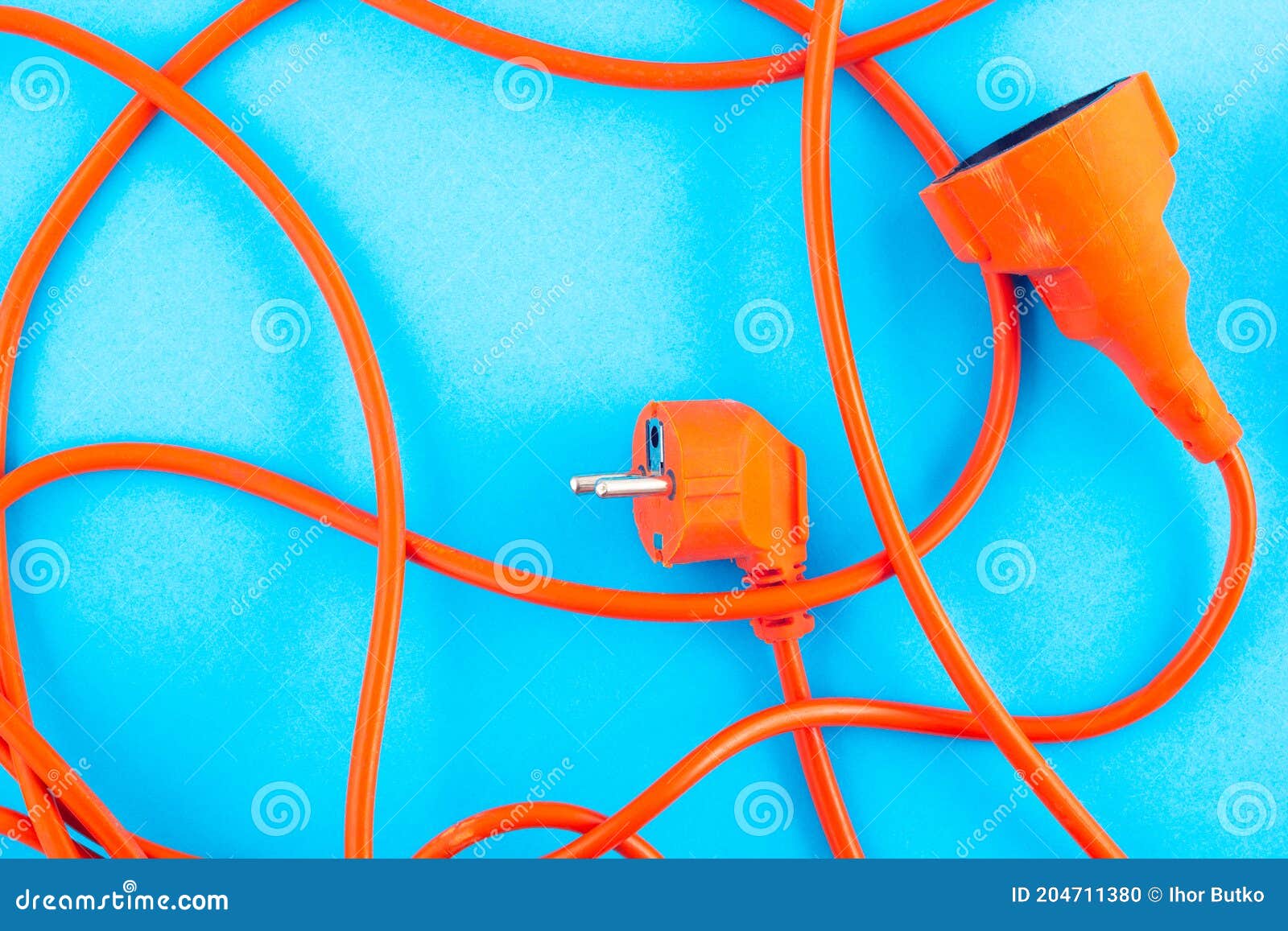Orange Electrical Wire on Blue Background. Stock Photo Image of