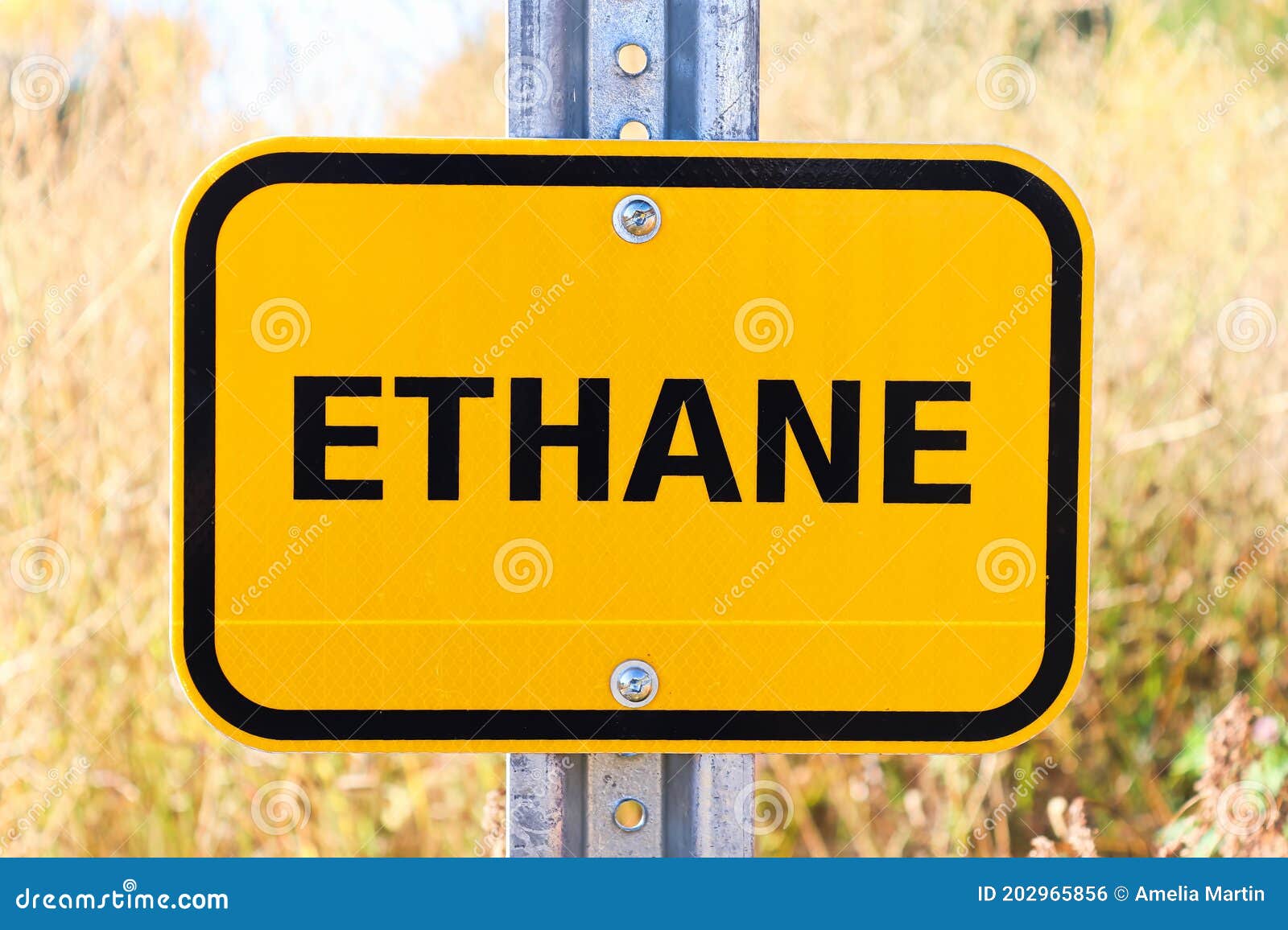 An Orange Ethane Warning Sign on a Post Stock Photo Image of
