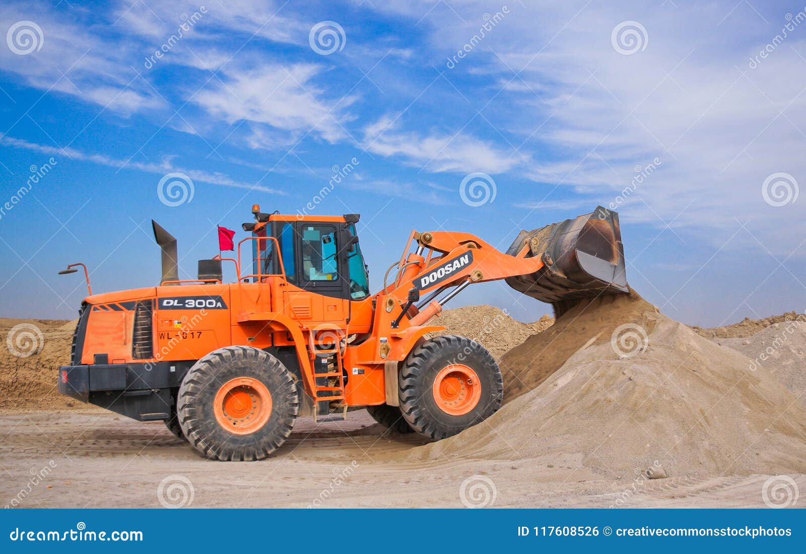 Orange Excavator On Brown Hill Picture. Image 117608526