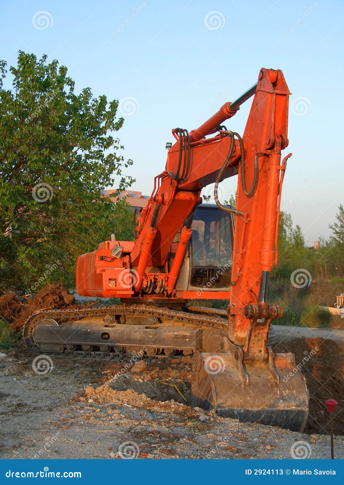 Orange excavator vertical stock image. Image of heavy 2924113