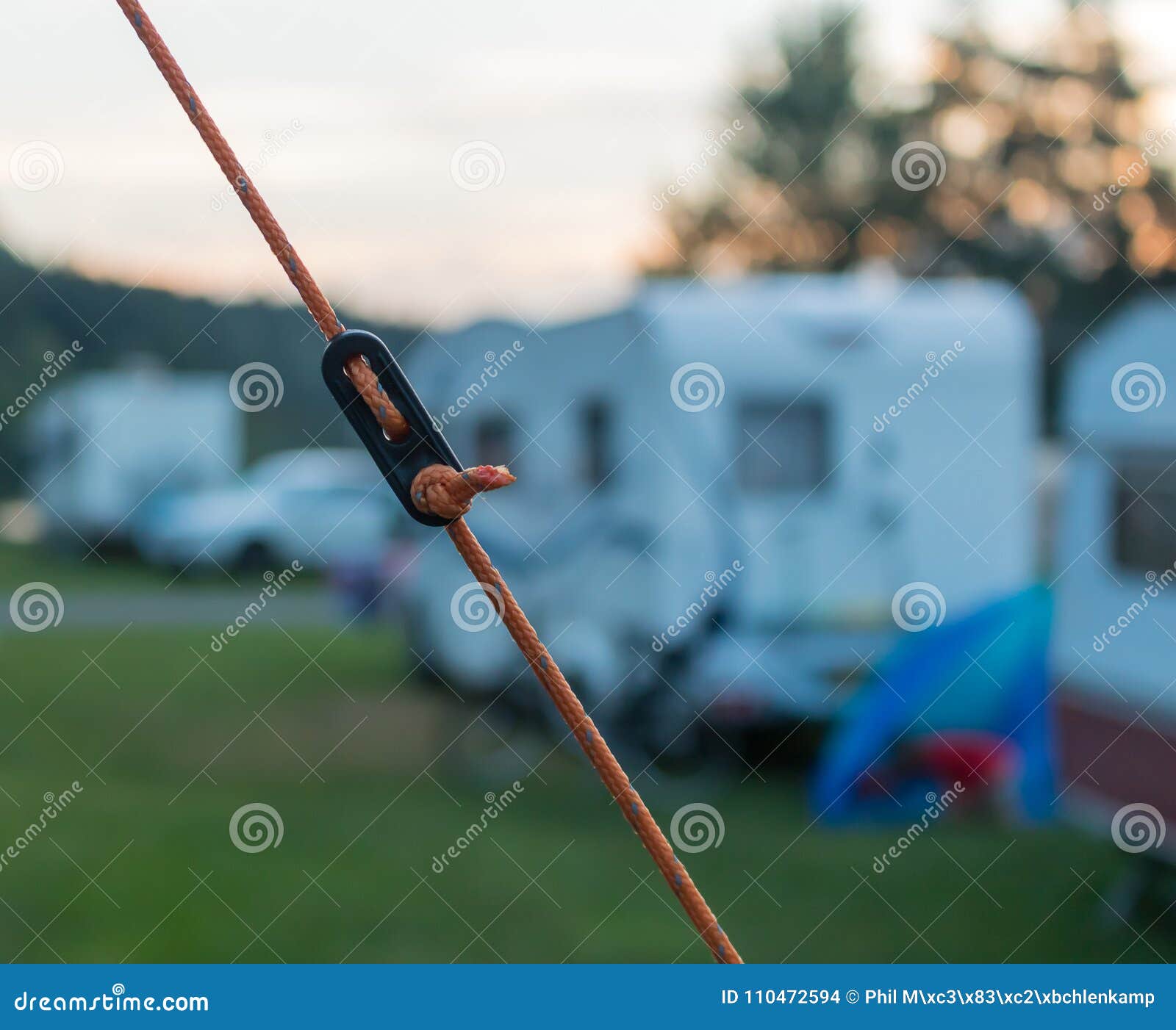 Orange Guy Rope of a Tent with a Knot in Front of a Camping Pitch Stock  Photo - Image of caravan, macro: 110472594