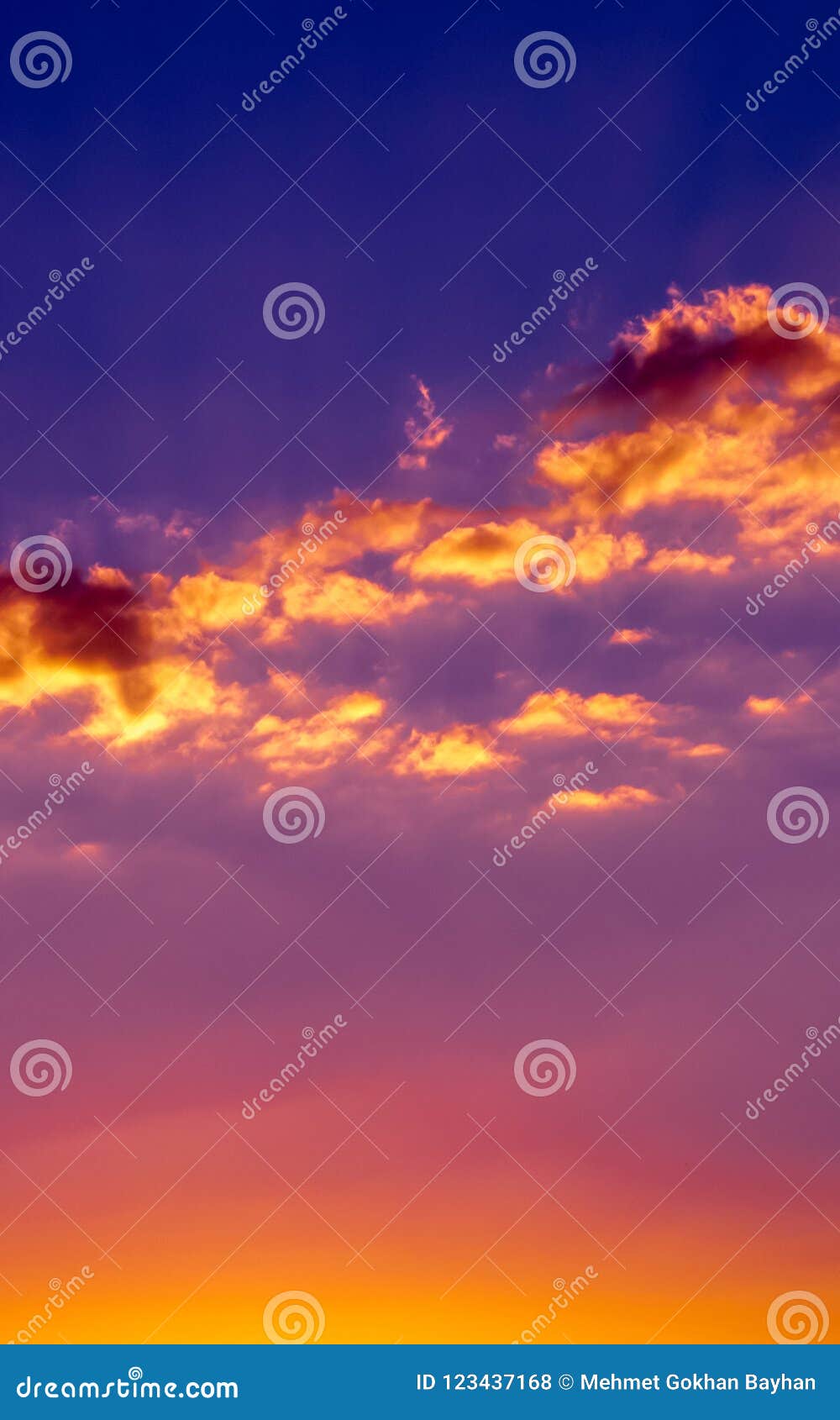 orange hued clouds on colorful sunset sky