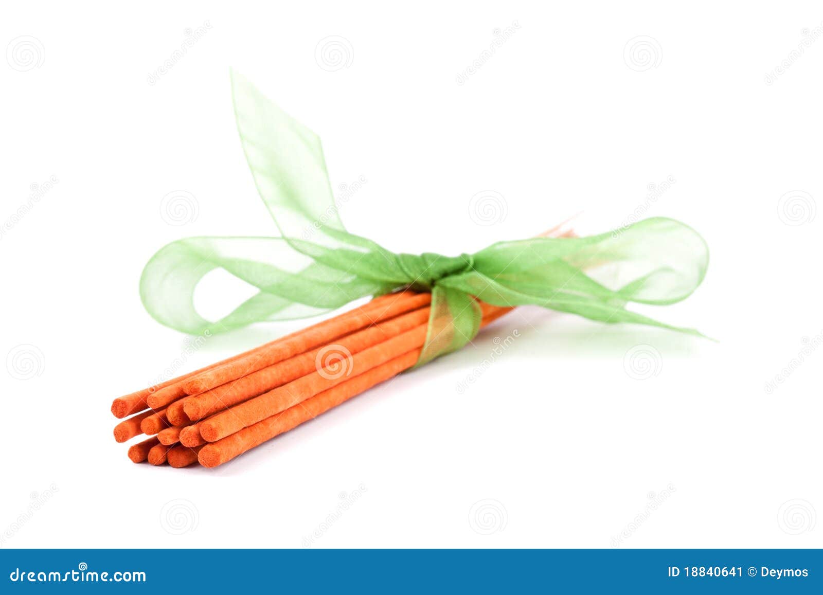 orange incense sticks tied with green tie on white