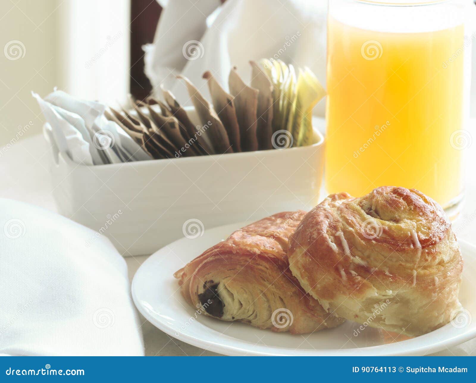 Orange Juice and Cinnamon Roll. Stock Image Image of fattening