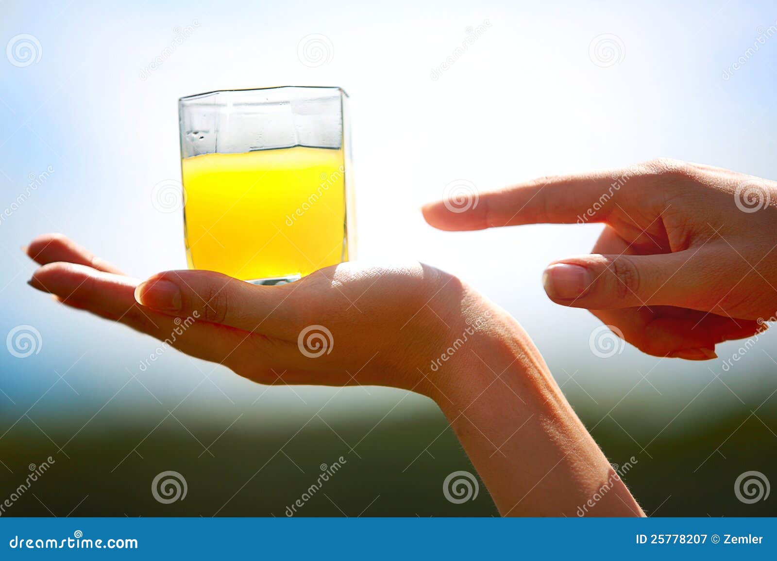 Orange juice on hand stock image. Image of hand, glass 25778207