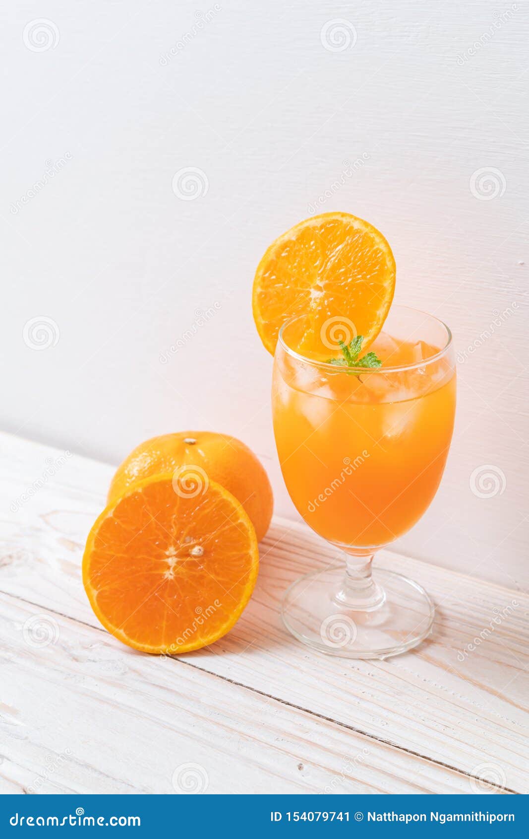 Orange juice with ice stock image. Image of juicy, liquid - 154079741