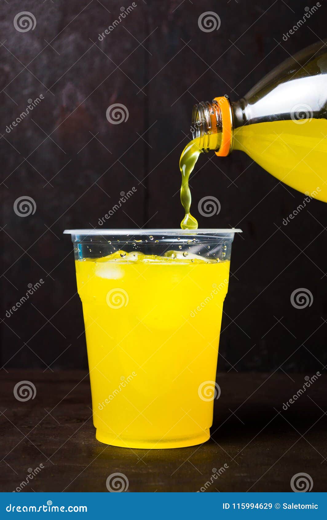 Orange Juice Poring In A Cup With Ice Stock Image - Image ...