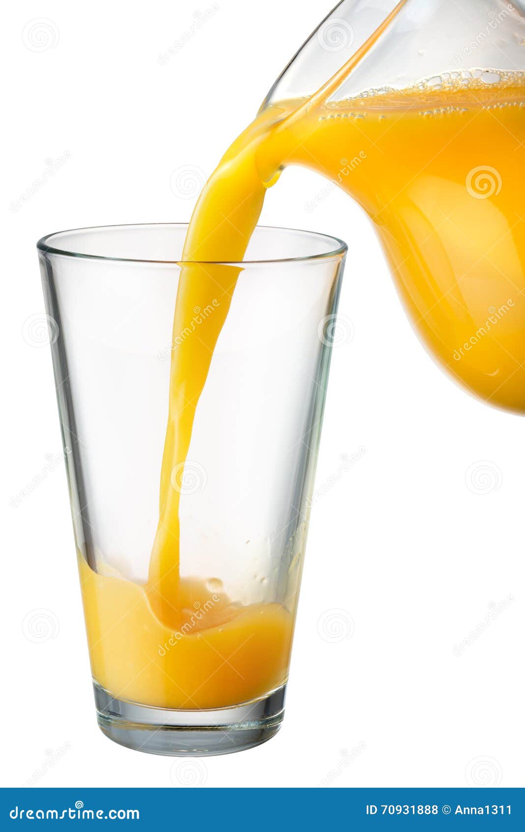 Orange Juice is Poured from Pitcher into the Glass Stock Photo Image