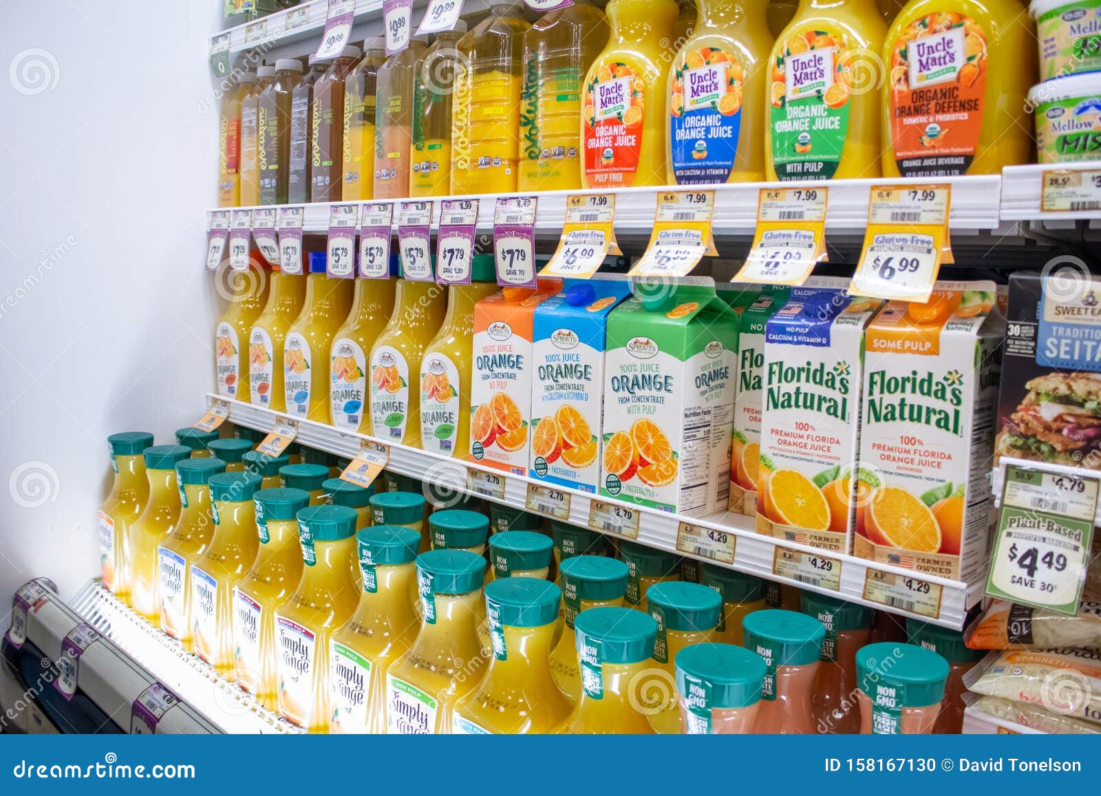 Orange Juice at the store editorial image. Image of fridge 158167130