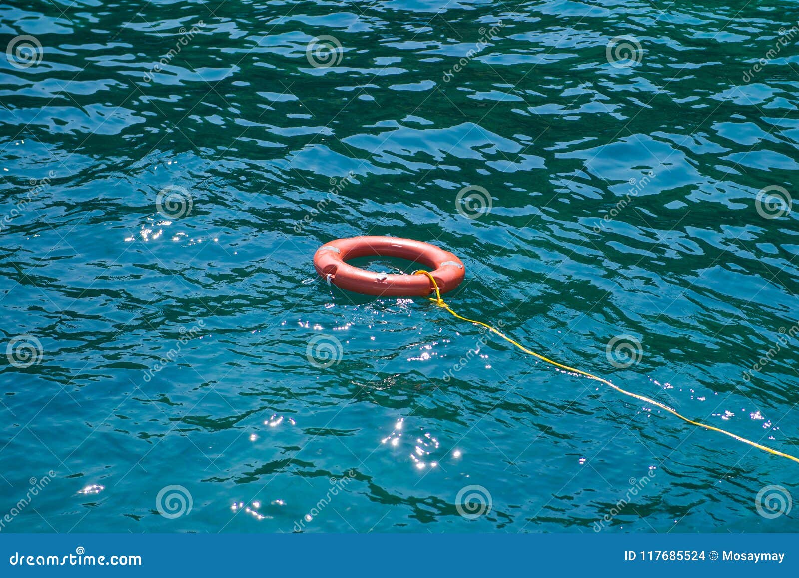Orange Lifebuoys Float on the Sea Stock Photo - Image of ocean, float ...