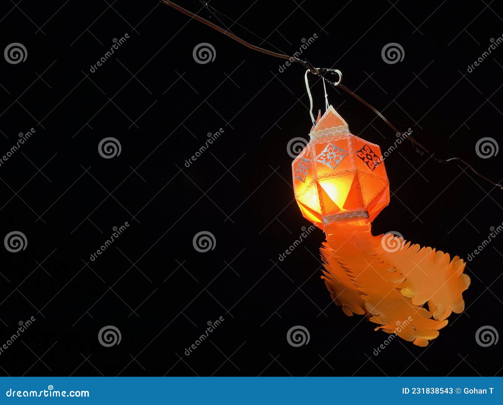 orange light at dark midnight floating lantern in lot kratong festival